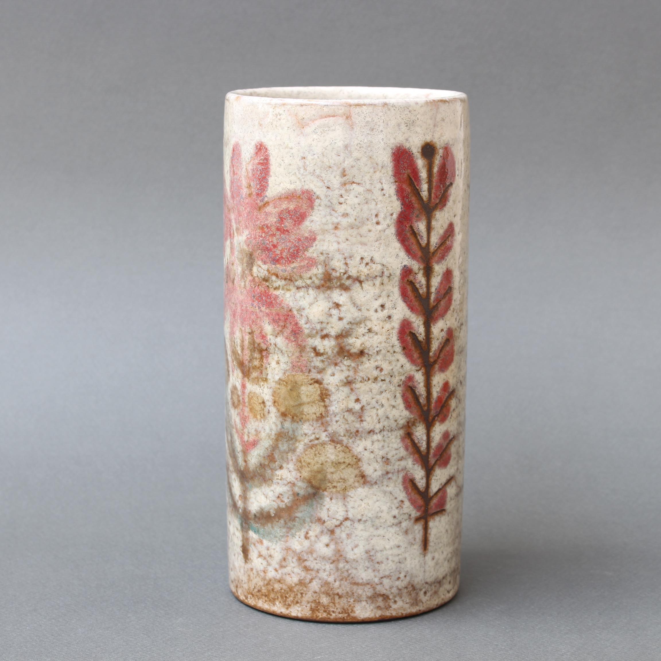 Vintage French ceramic flower vase by Le Mûrier (circa 1960s). A charming cylindrical vase in the unmistakable Le Mûrier Provençal style with their trademark stylised mulberry flower and upright leaf motif. The underlying glaze is a hazy off-white,