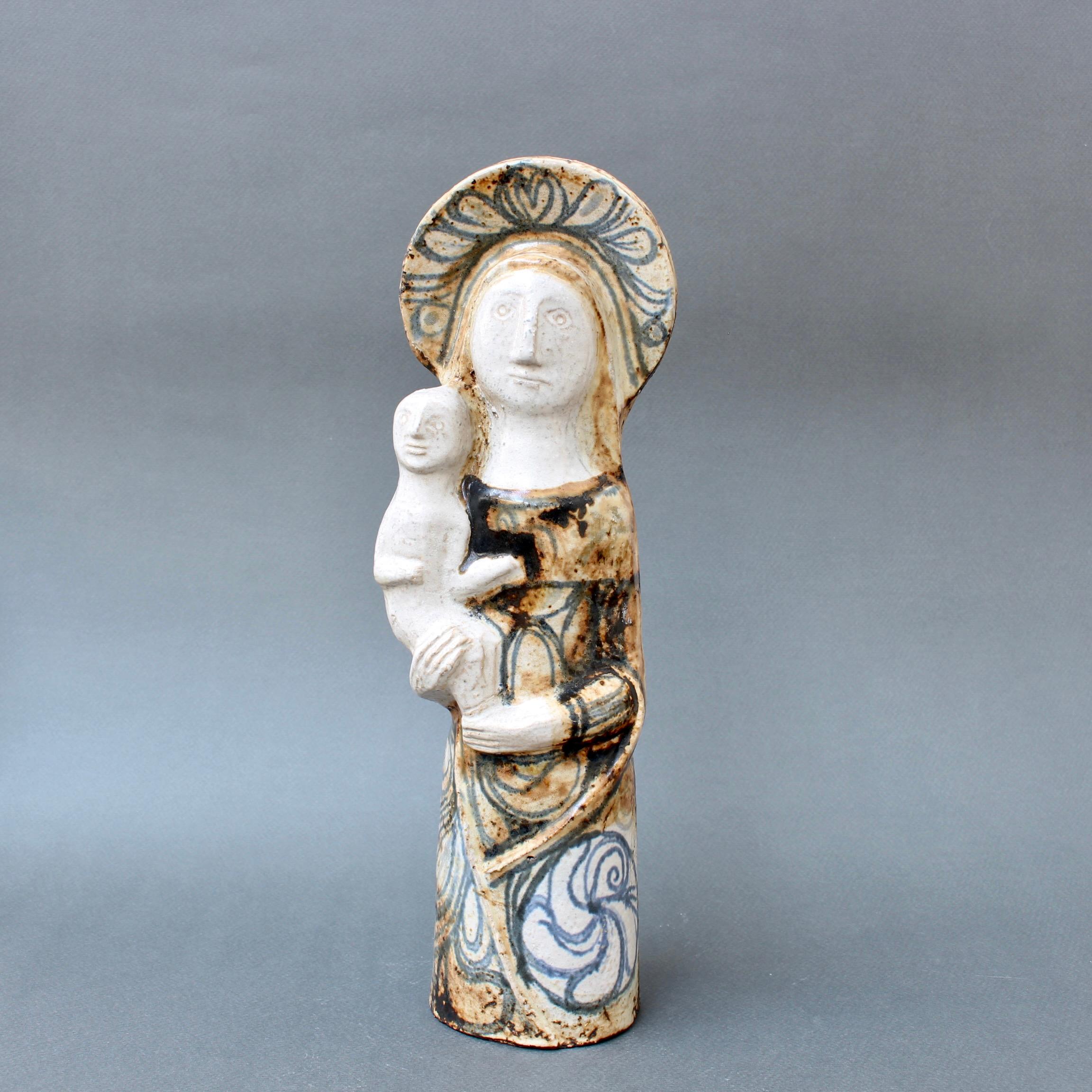 Vintage French ceramic of the Virgin with Child by Jean Derval (circa 1950s). Given Jean Derval's religious convictions, it's hard not to think of this exquisite ceramic sculpture as an explicit spiritual statement of hope, determination and faith.