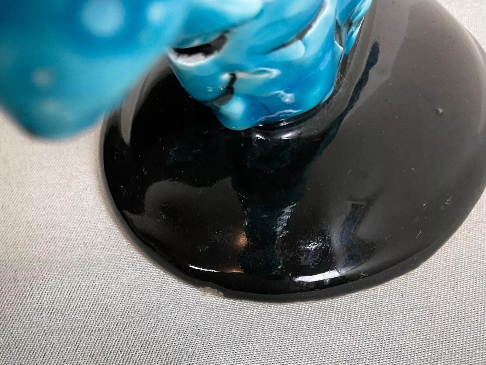 Discover the elegance of 20th-century French design with this antique ceramic three-branch chandelier. Crafted in faience with a striking blue and black cracked glaze finish, it measures 6.10 x 8.07 x 3.54 inches (15.5 x 20.5 x 9 cm) and weighs 645
