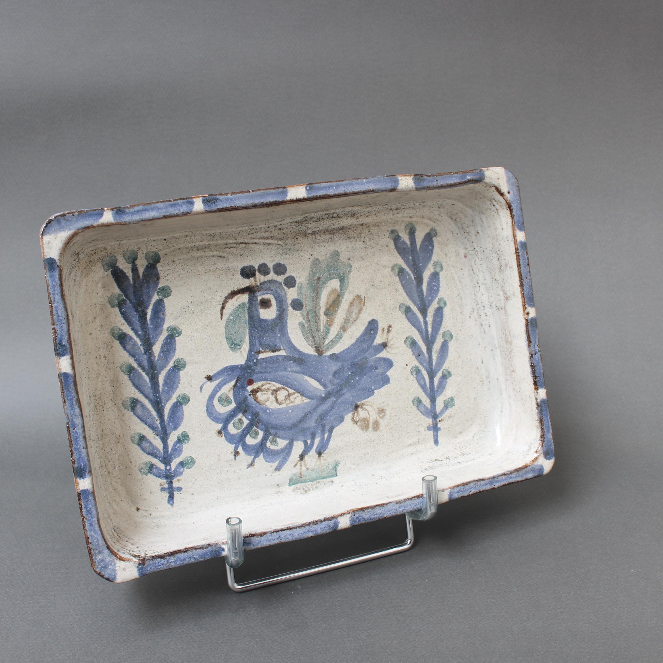 Mid-century French ceramic tray by Gustave Reynaud for Le Mûrier (circa 1960s). Rectangular-shaped tray (similar to a cake pan shape) with raised rim and slightly rounded ends in rustic earthenware. The base of the tray incorporates a delightful
