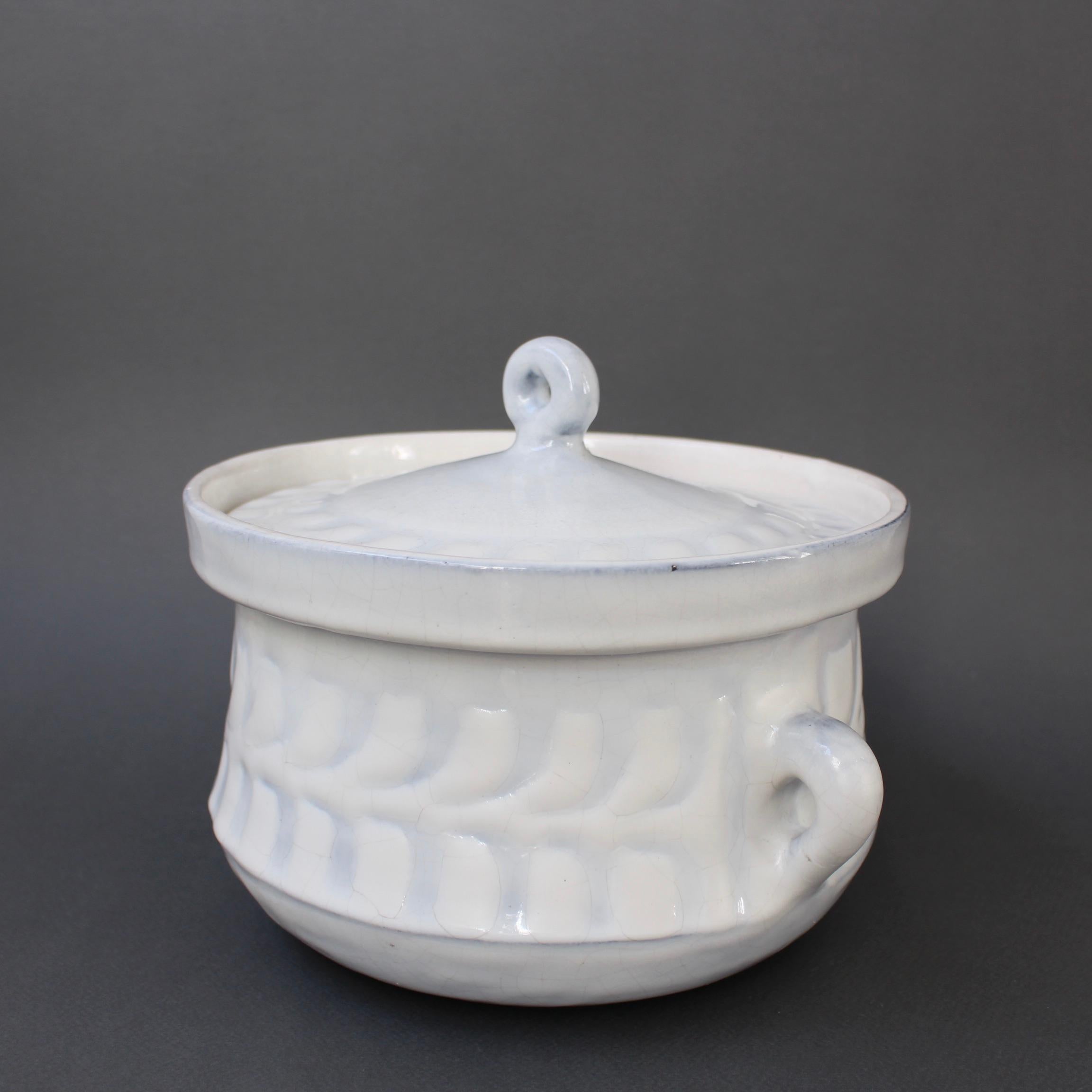 Vintage French ceramic tureen by Roger Capron (circa 1960s). A luscious creamy white base with subtle grey-blue hues in the repeating décor pattern is graceful and charming all at once - elegant in all its simplicity. The bowl has handles on both