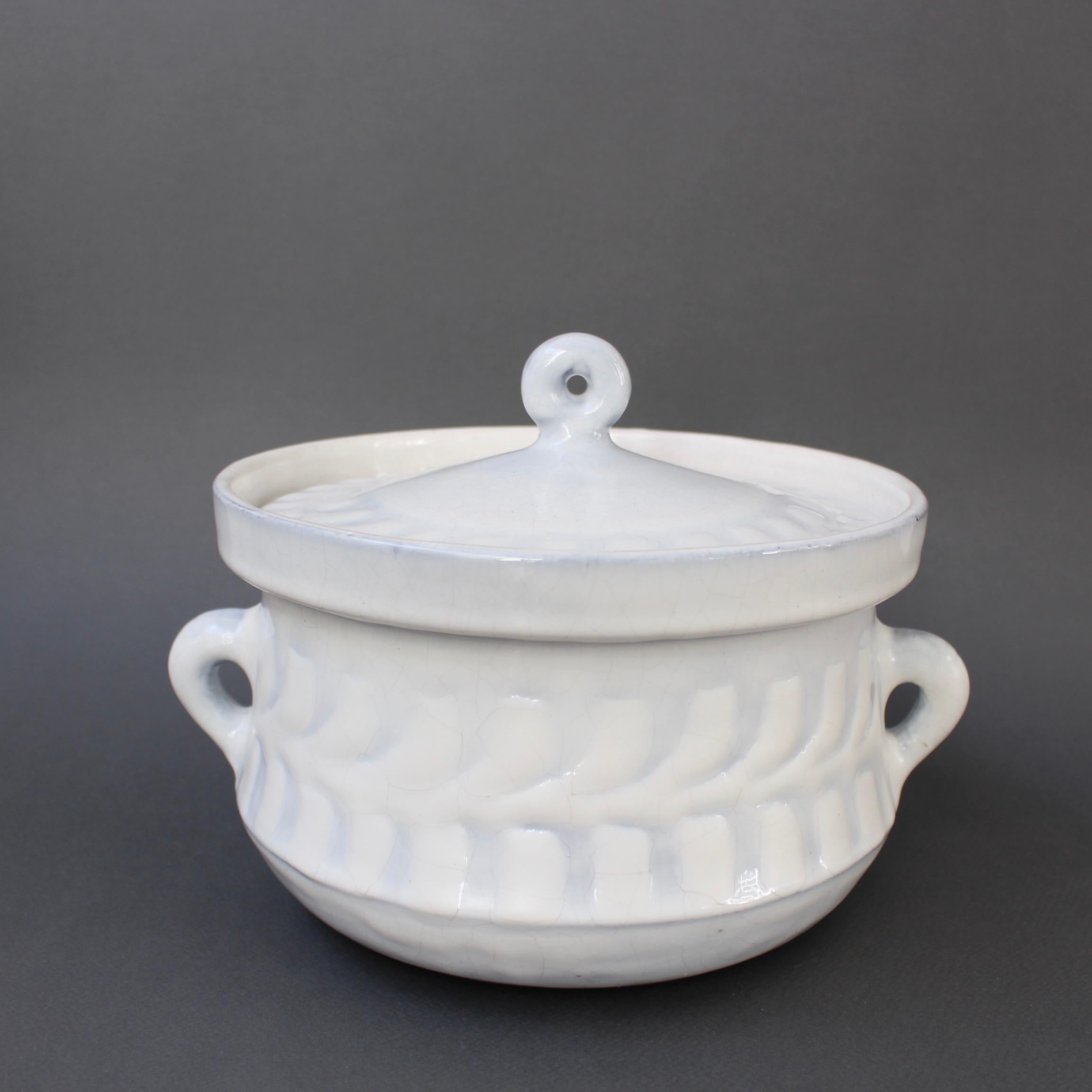 Vintage French ceramic tureen by Roger Capron (circa 1960s). A luscious creamy white base with subtle grey-blue hues in the repeating décor pattern is graceful and charming all at once - elegant in all its simplicity. The bowl has handles on both