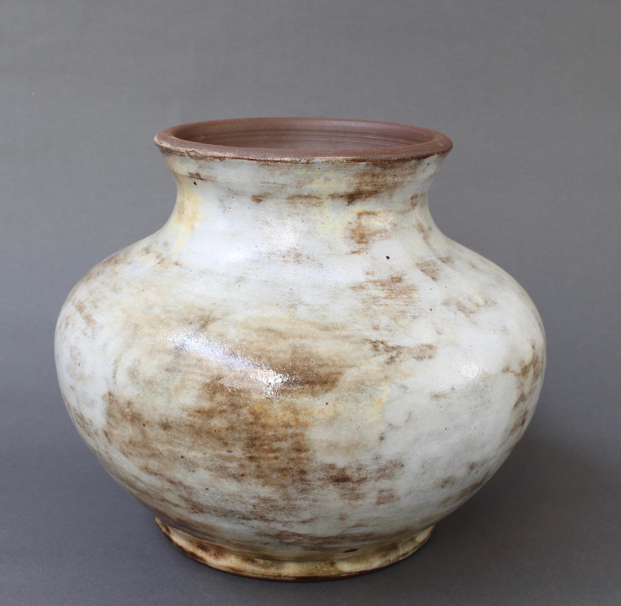 French ceramic decorative vase by Alexandre Kostanda, Vallauris, France (circa 1960s). In his trademark natural clay and rustic style, Kostanda created beautifully original vessels, such as vases, pitchers and pots which were both utilitarian and