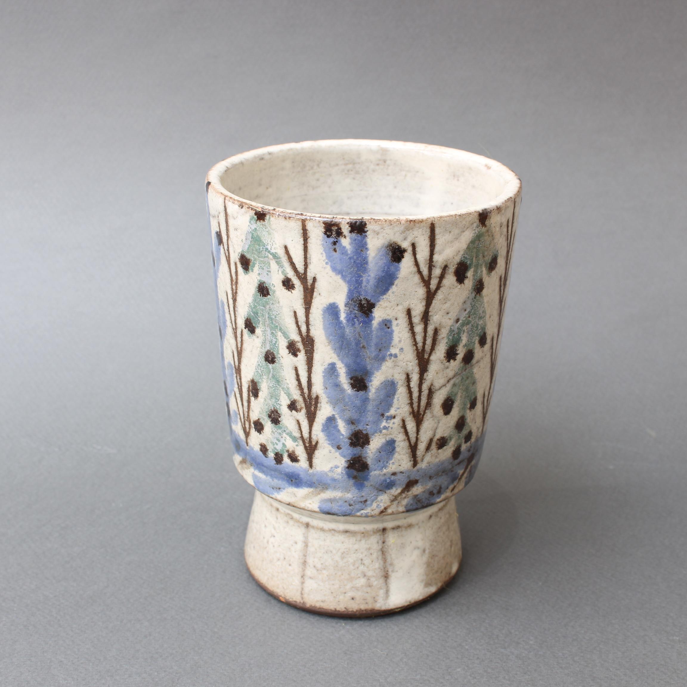 Small vintage ceramic vase by Gustave Reynaud, Le Mûrier (circa 1950s). This delightful flower vase is a work of art in the trademark style of Gustave Reynaud. On the rustic exterior you will find charming foliage with baby blue petals along with