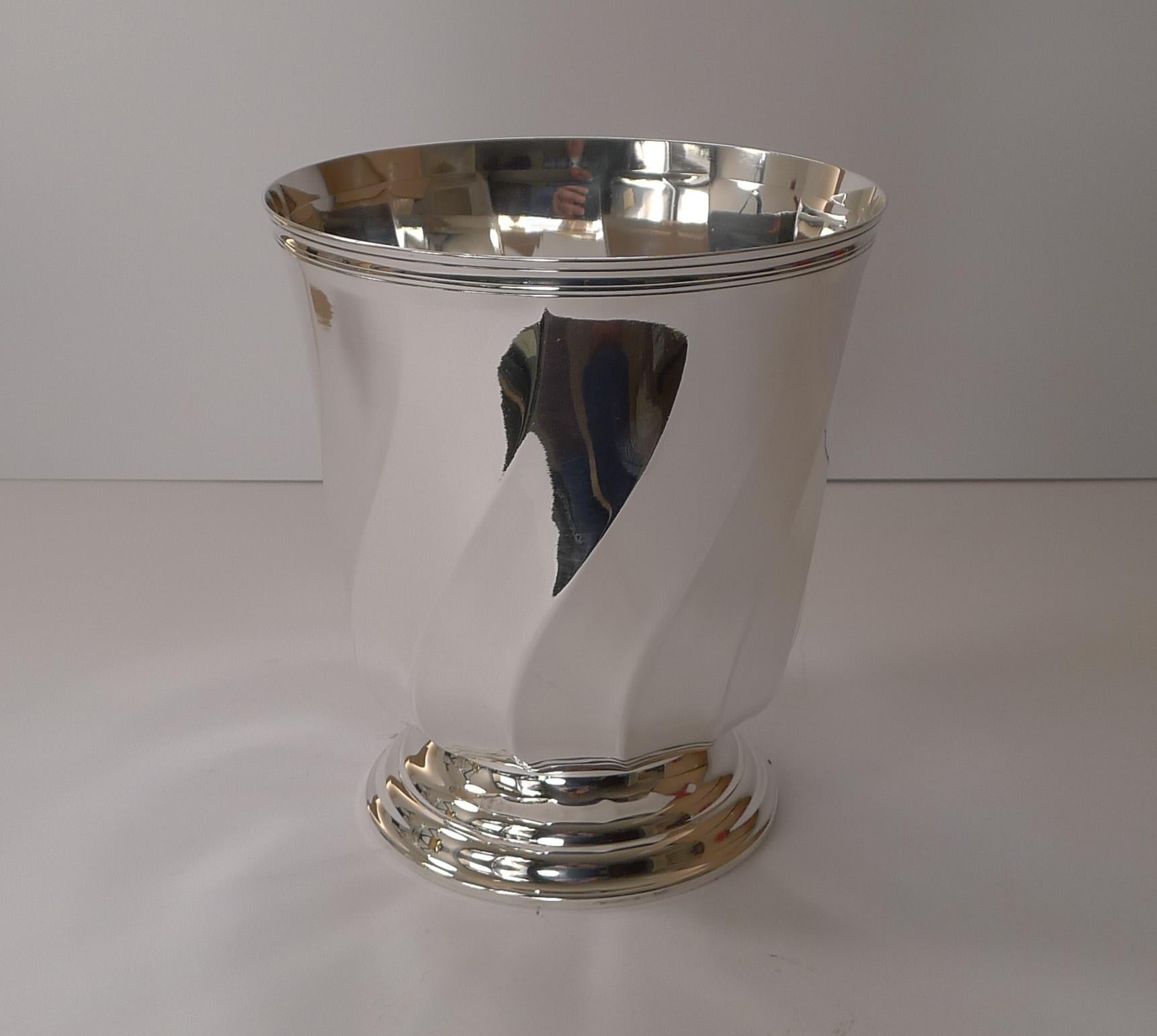 A handsome vintage French silver plated wine cooler / champagne bucket by the top notch silversmith, Christofle of Paris. Fully marked on the underside, this modernist design dates to c.1980.

Just back from our silversmith's workshop where it has