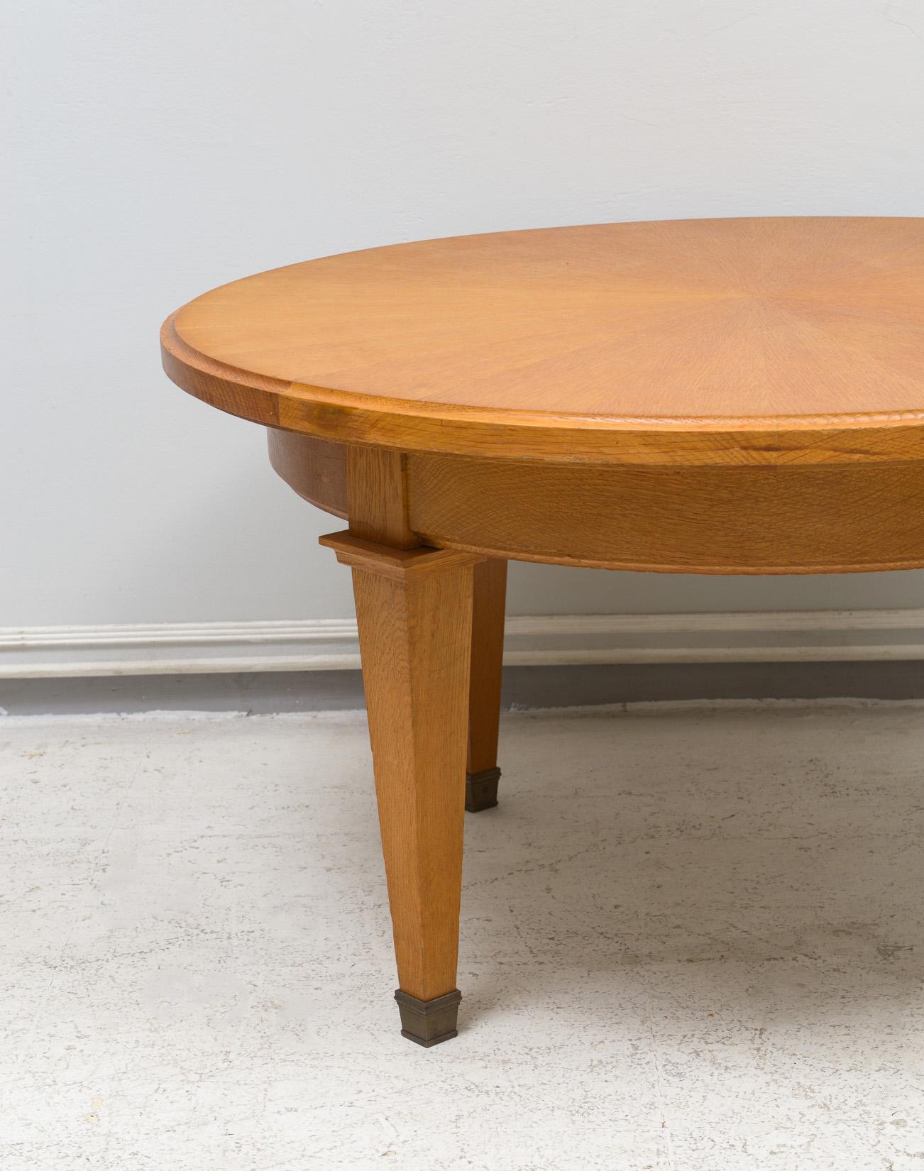 Modern Vintage French Circular Coffee Table in Oak on Tapered Legs with Brass Sabots For Sale