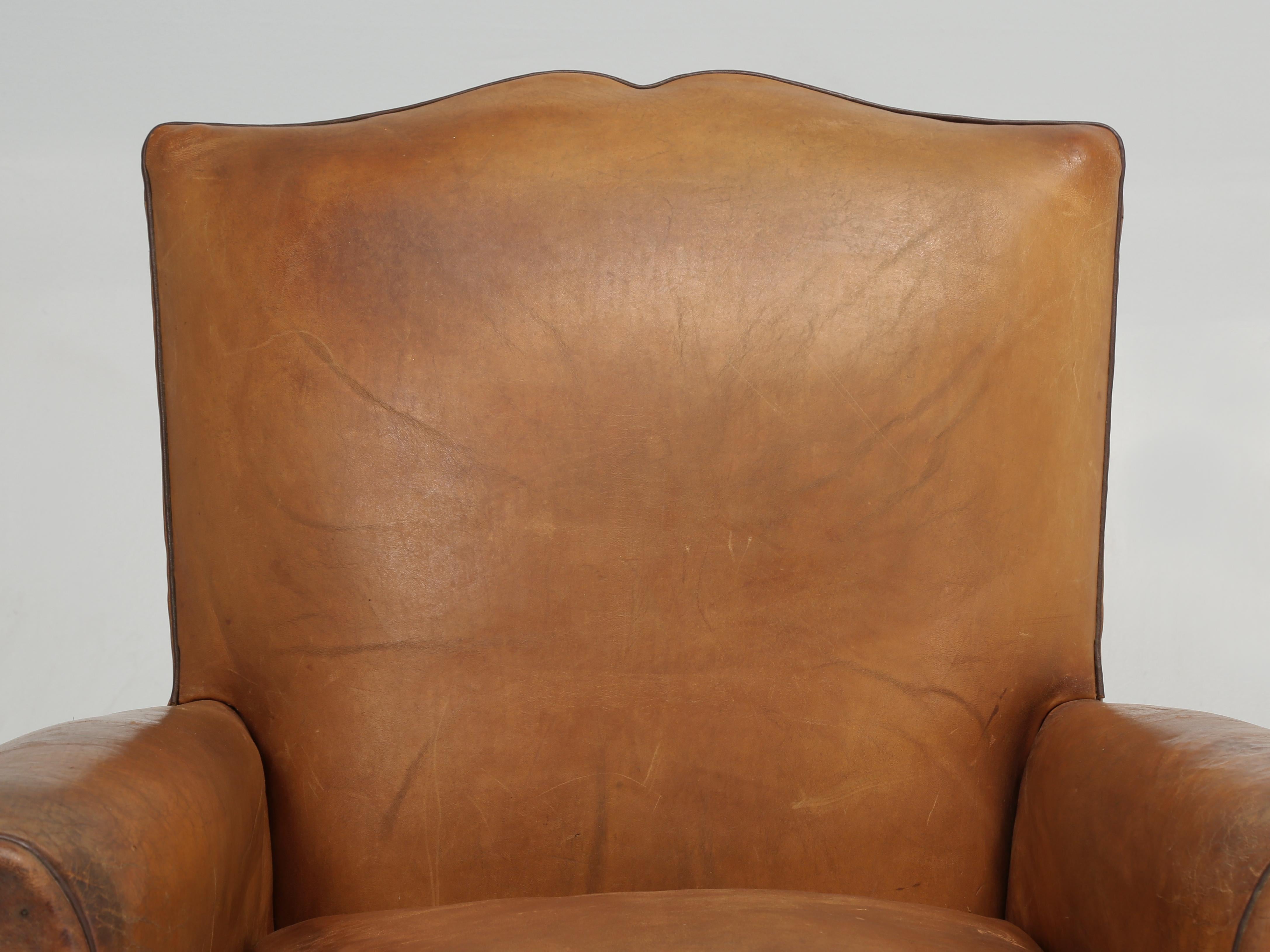French Leather Club Chair that remains cosmetically all original, while internally we have gone through all the components; horsehair, coco fibres etc. This is a French Leather Club Chair that we would classify as a smaller version and they