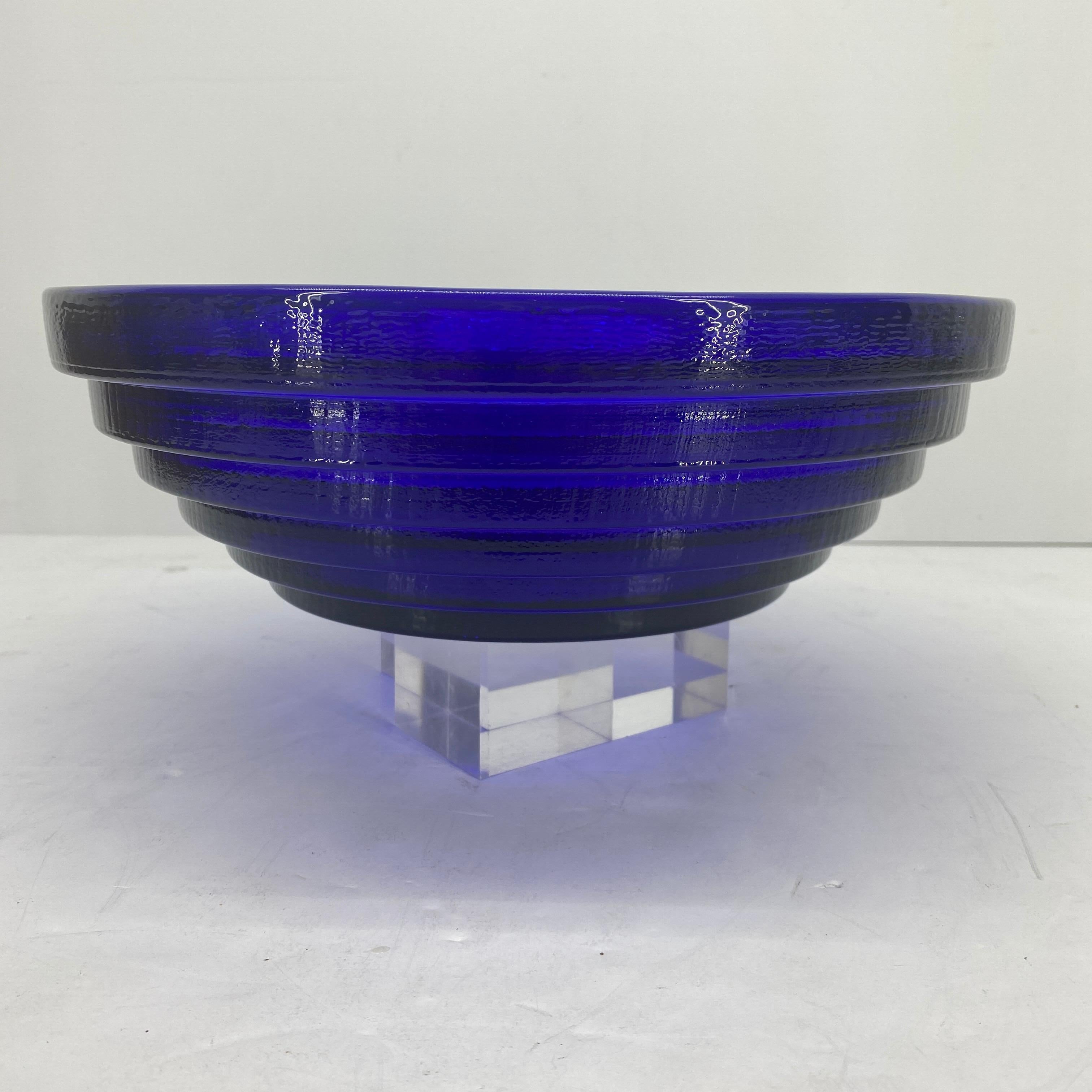 French cobalt blue glass bowl with unusual dramatic steeped exterior detailing. This beautiful and functional bowl is large enough for serving a crowd or just pretty enough to be a dazzling centerpiece. 
 