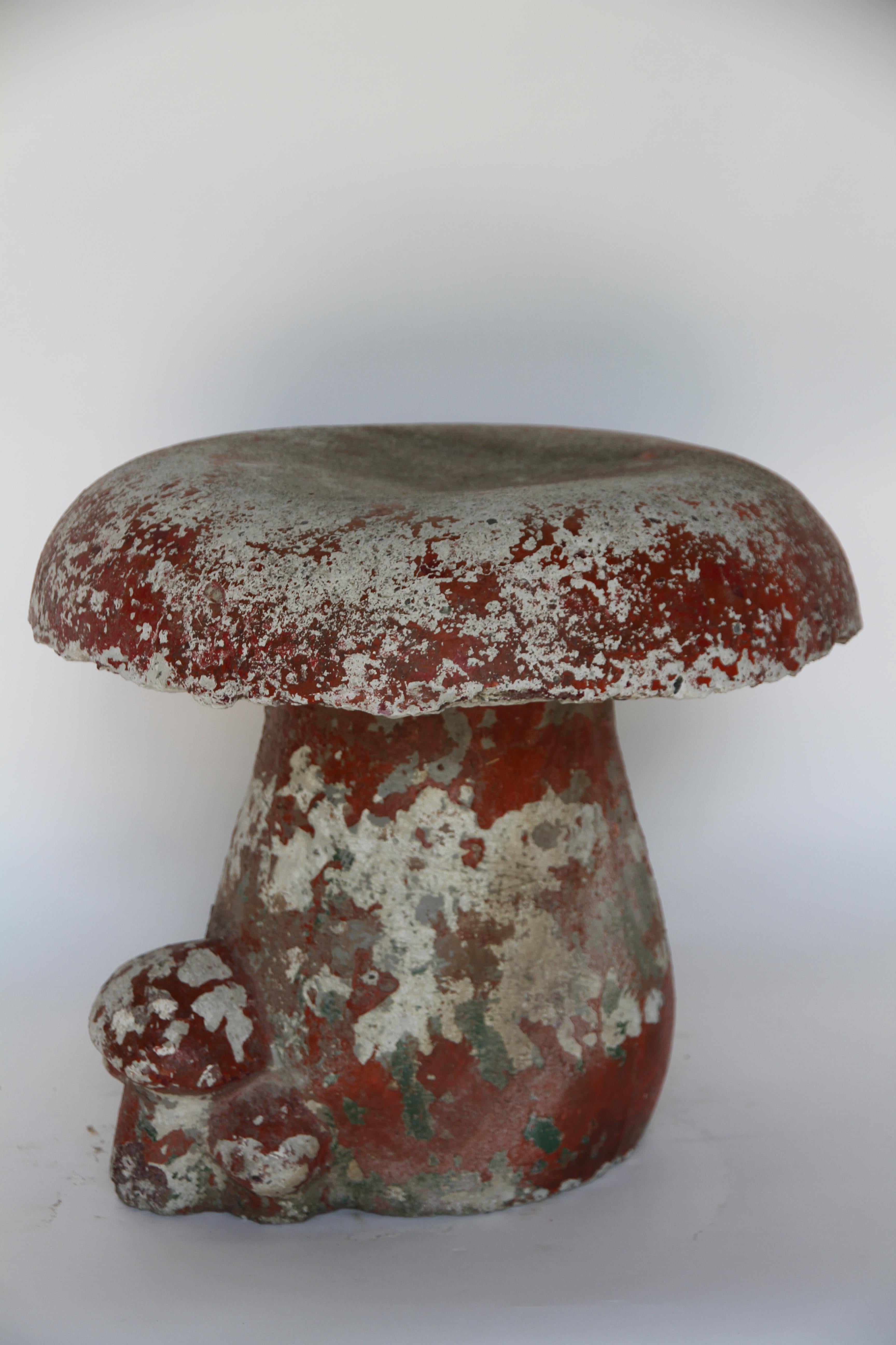 Found in France, this cement mushroom serves well as a whimsical garden element. The mushroom would also make a unique stool or drinks table. 