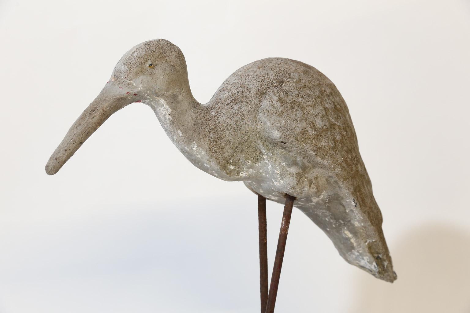 This concrete shore bird sits on iron legs and a concrete base. Found in southern France this piece will add a bit of whimsy to your home or garden.