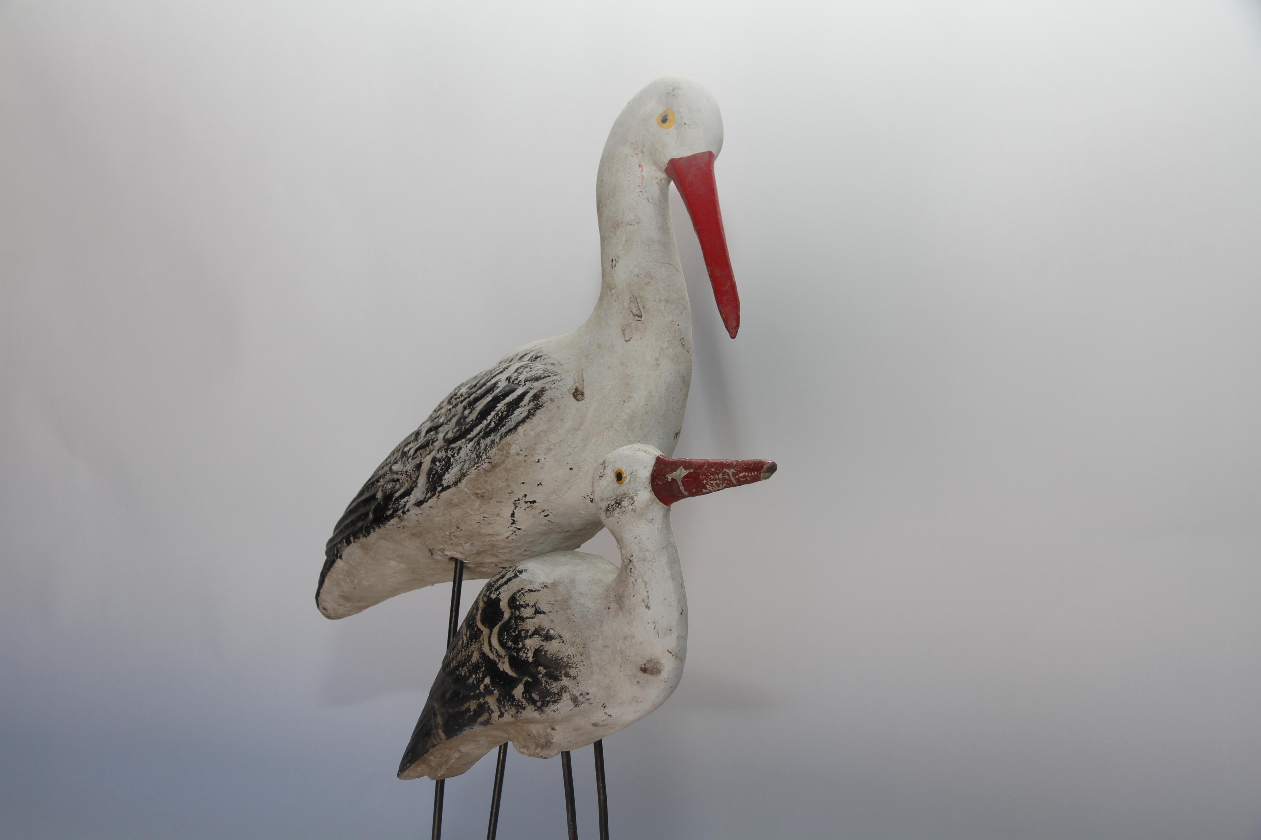 A vintage piece consisting of two concrete shore birds with iron legs mounted on a concrete stand, a lovely addition for inside or outdoors. Found in France, this piece will add a bit of whimsy to your home, beach house or garden.