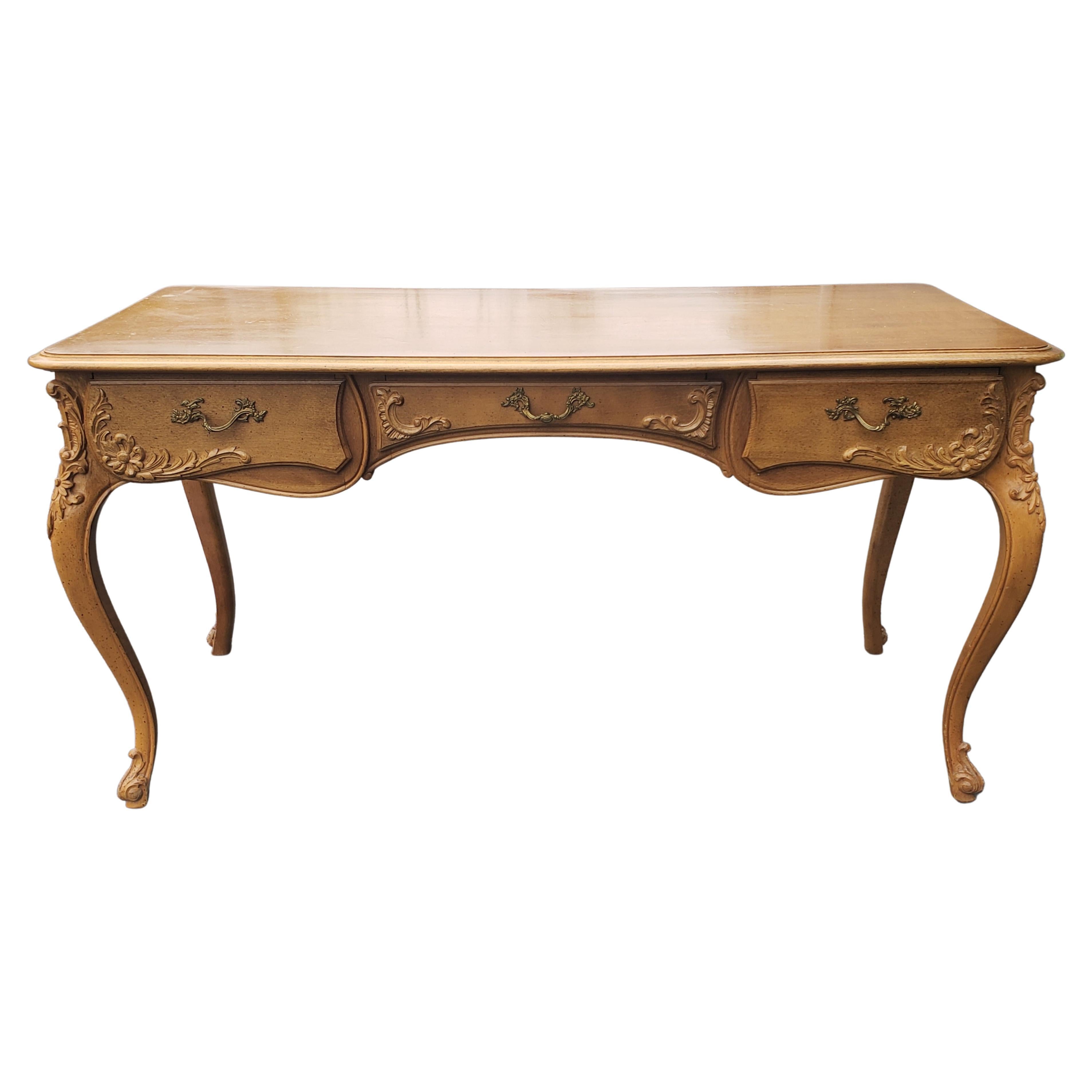 Beautiful French writing desk in solid maple.
Intricate carvings and original hardware. 
Measures 56
