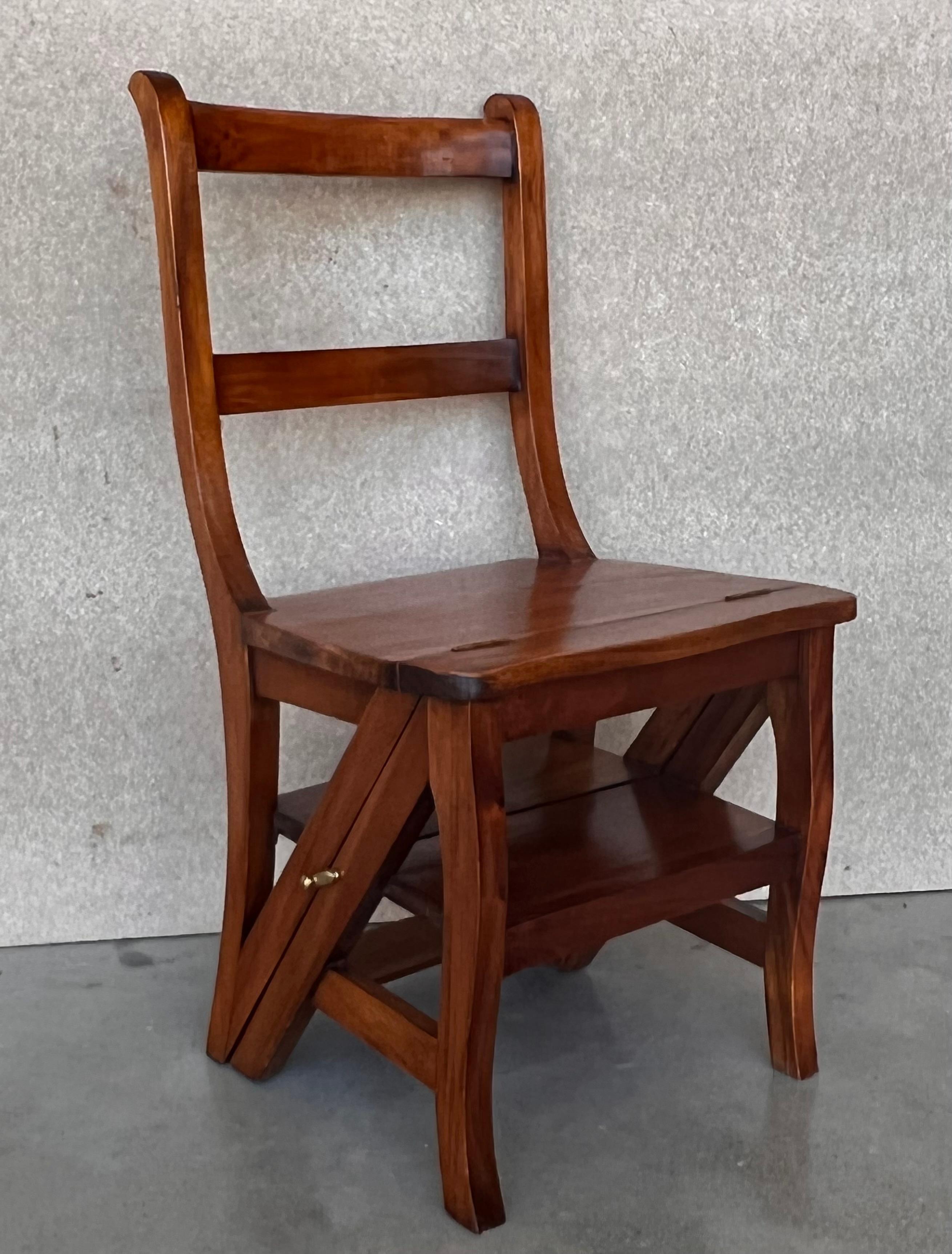 Decorate a library or study with this artisan-made folding step ladder chair. Crafted in Southern France circa 1950, the metamorphic chair features three carved ladders in the back; the double-function piece is hinged so that it can convert into a