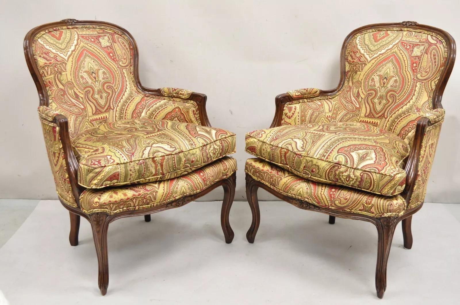 Vintage French Country Carved Walnut Burgundy Bergere Lounge Arm Chairs -a Pair. Item features down filled cushions, solid carved wood frames, distressed finish, great style and form. Circa Mid 20th Century. Measurements: 37