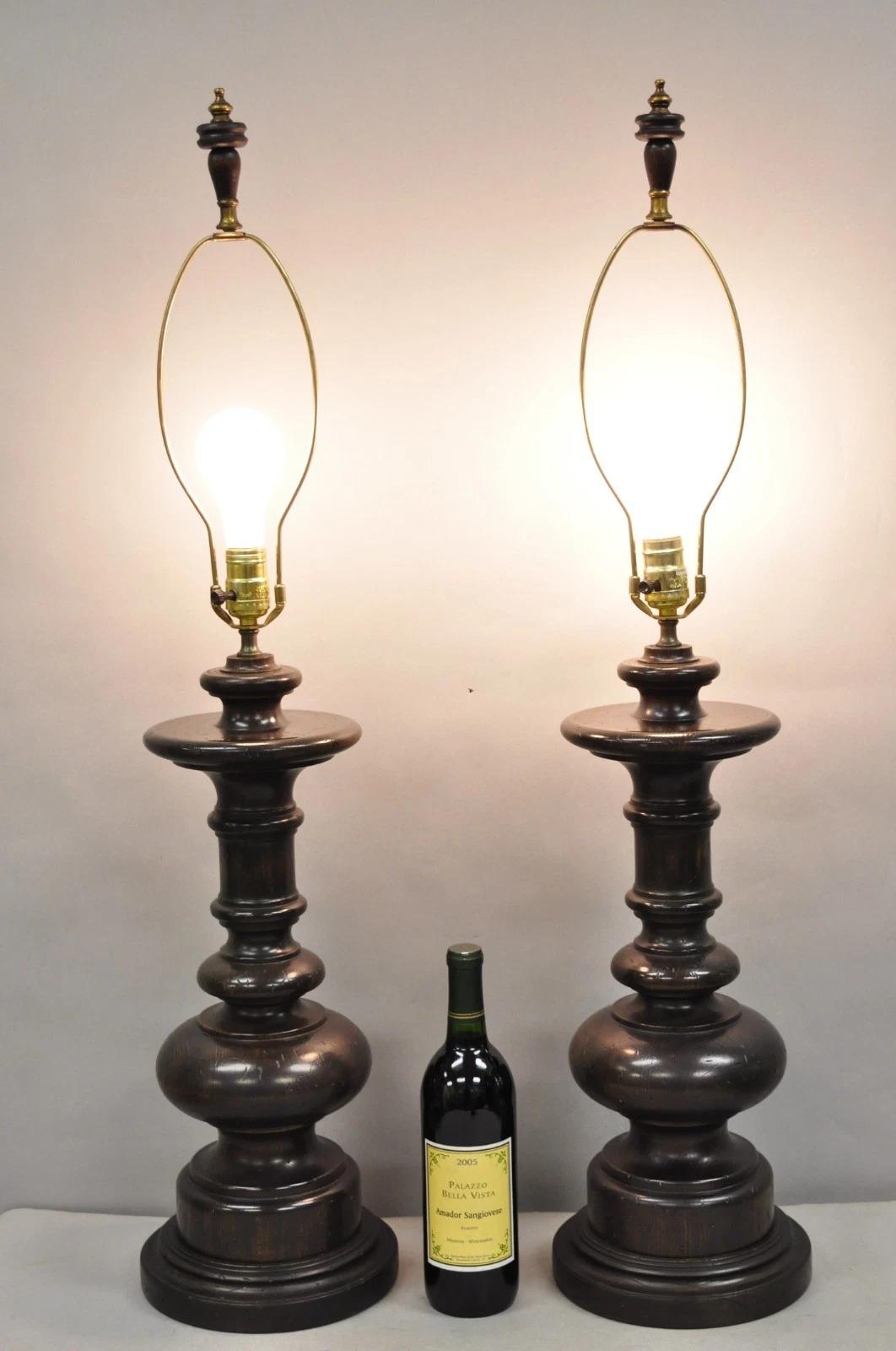 Vintage French Country Farmhouse Distressed Solid Turn Carved Wood Column Table Lamps - a Pair. Circa Late 20th Century. Measurements: 38