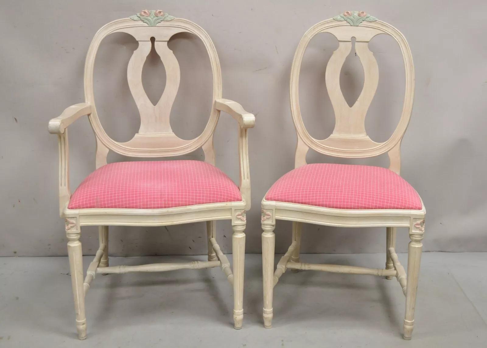 Vintage French Country Swedish Gustavian Style Painted Rose Carved Dining Chairs - Set of 8. Item features solid wood frames, pink rose ands floral leaf carvings, stretcher bases, pink upholstered seats, and an attractive cerused white washed