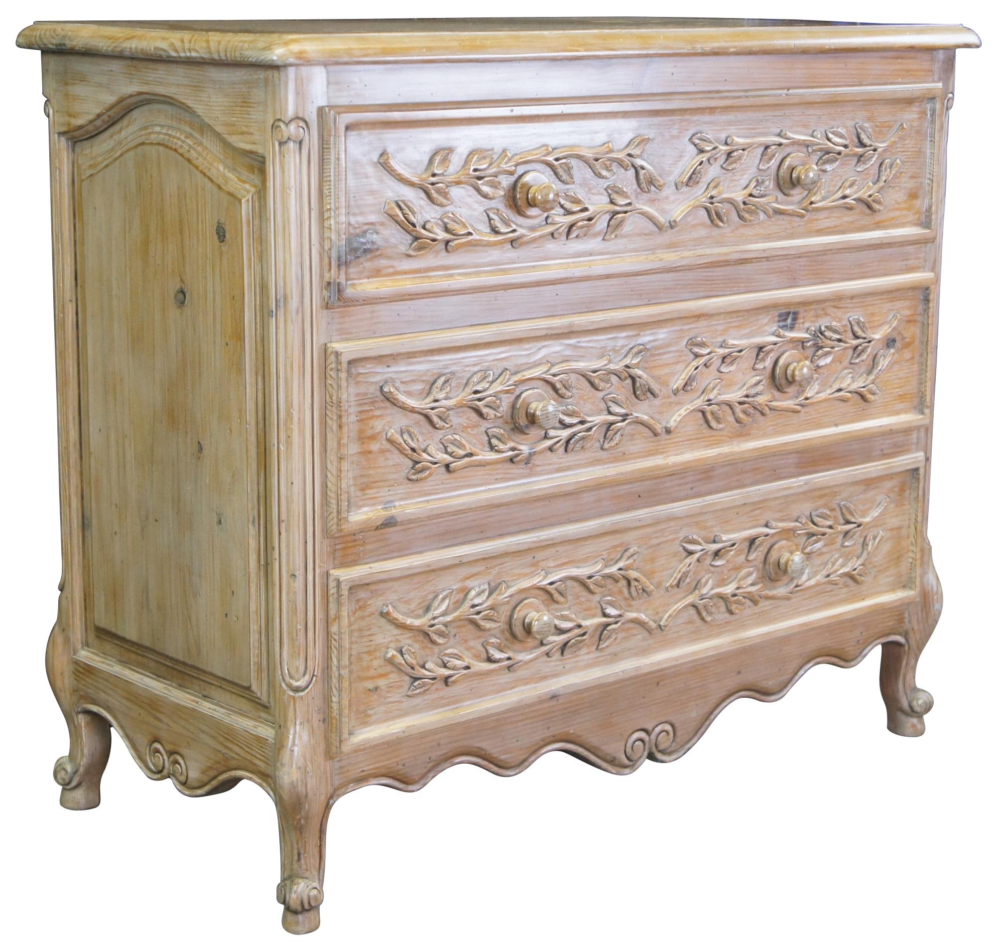 A lovely French farmhouse dresser or chest, circa 1970s. Made from pine with three dovetailed drawers, highlighted by an applied vine and leaf motif. The chest has recessed and arched moldings along the side and features a serpentine lower apron