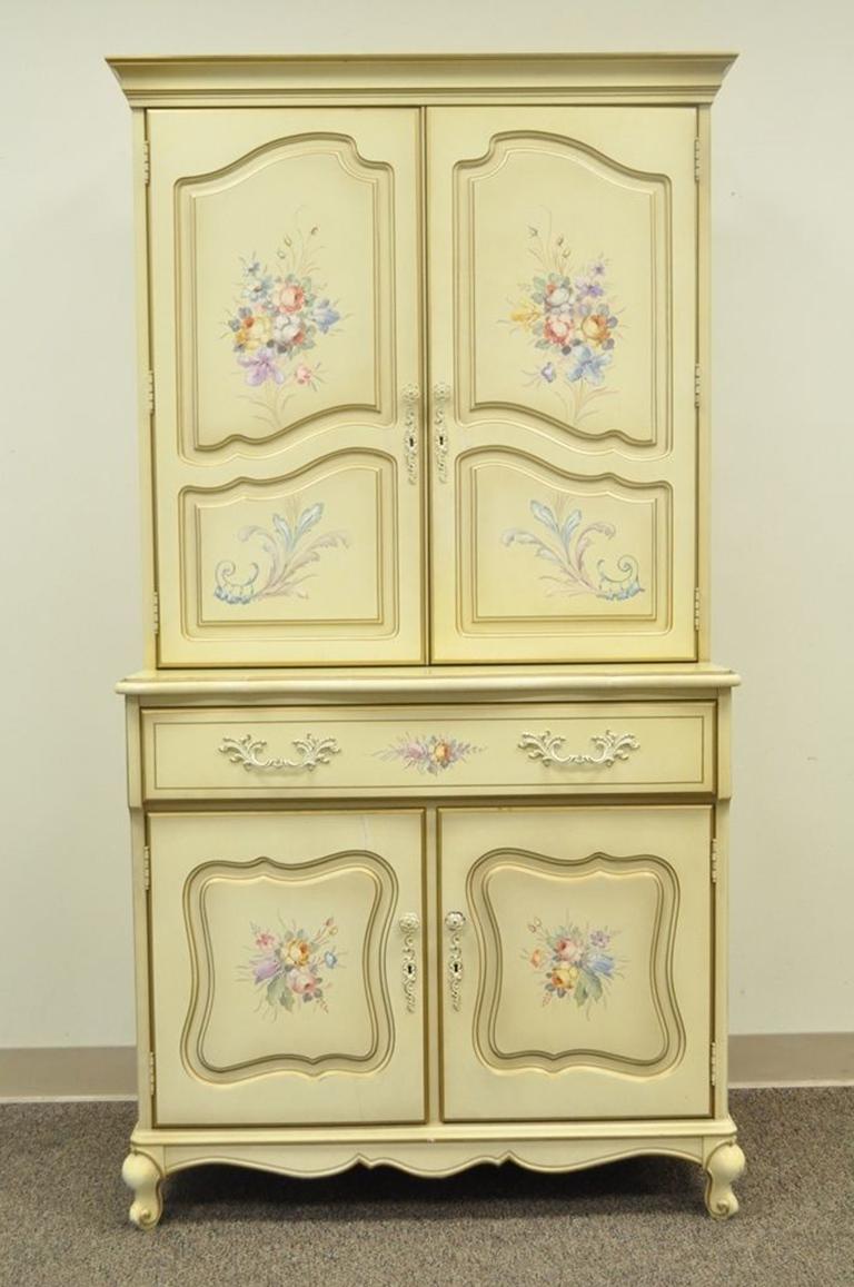 Vintage French Provincial liquor / cocktail cabinet. Believed to be a vintage custom order. Item details painted floral and figurative accents, Dovetail constructed drawer, Intentionally distressed mirrored back, Pull out bar surface, circa 1970.