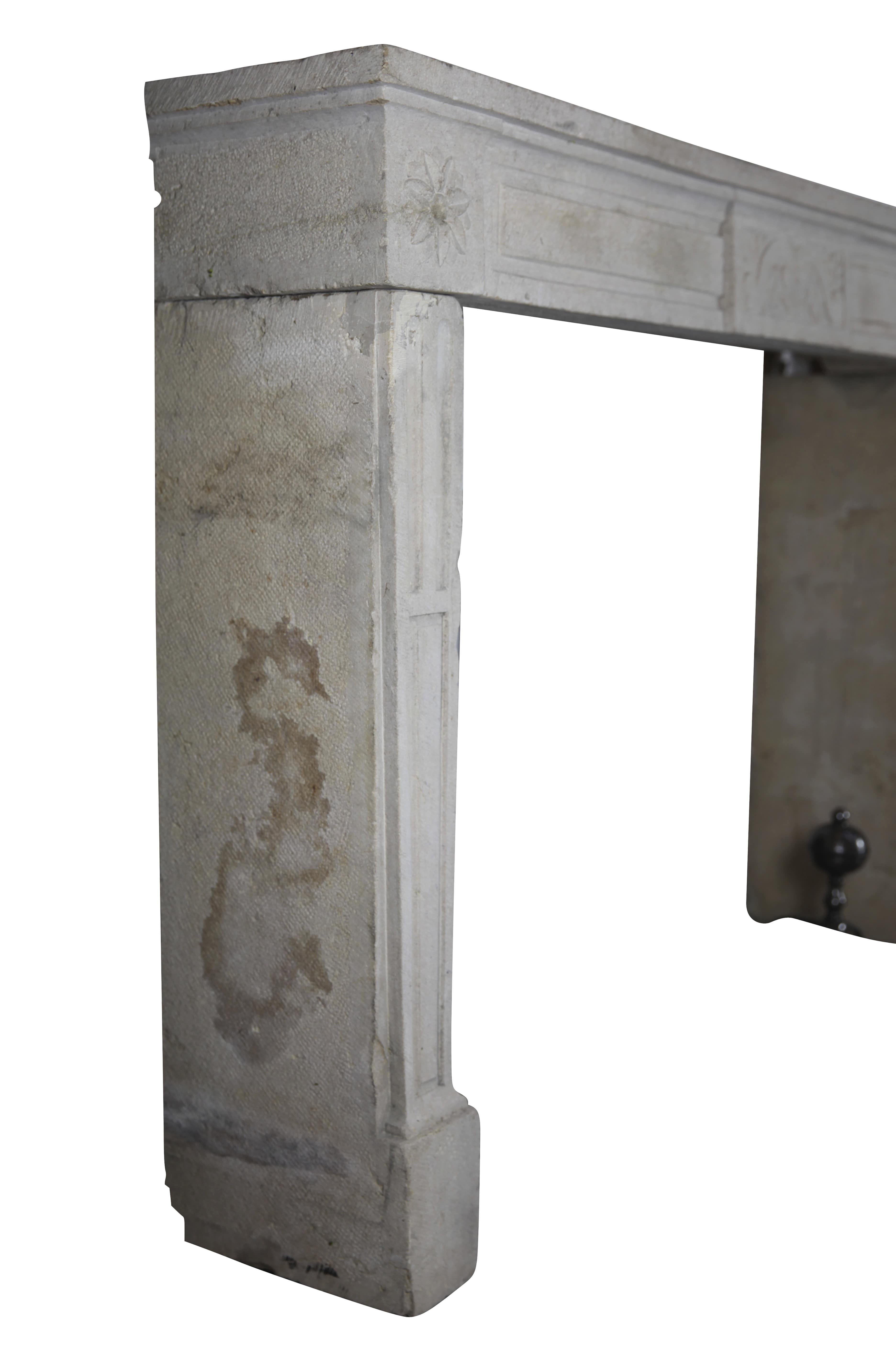 A French country limestone original antique fireplace mantle from the Louis XVI period, 18th century. The jambs are straight. Kind of Classic rustic chimney piece.
Measures:
162 cm exterior width 63.77 inch
108 cm exterior height 42.52 inch
132