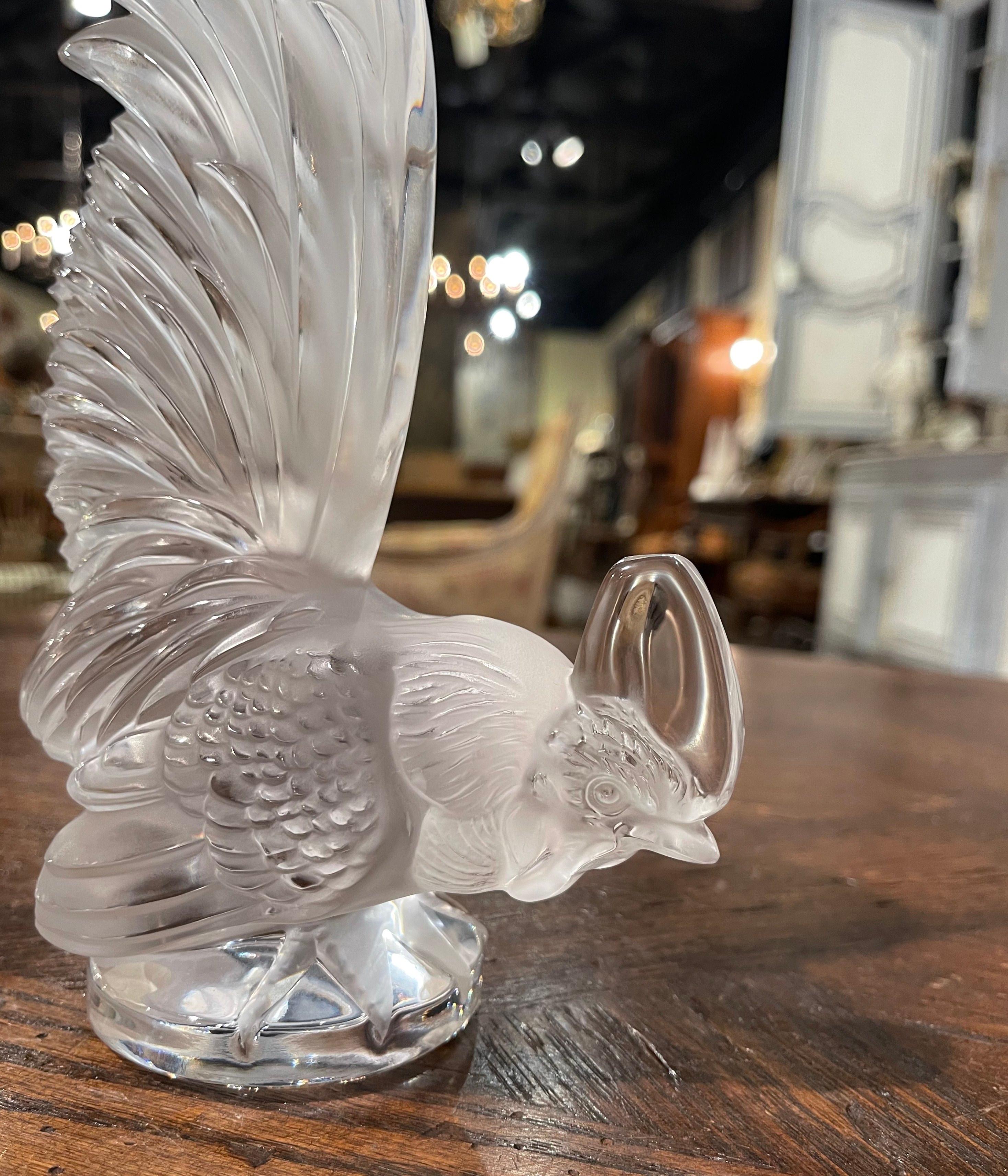 This intricately detailed Bantam Rooster captured in clear and frosted crystal by Lalique was hand made in France. It features a rooster with its tail feathers raised high and its head lowered. It is delicately hand finished to a satin glow. This