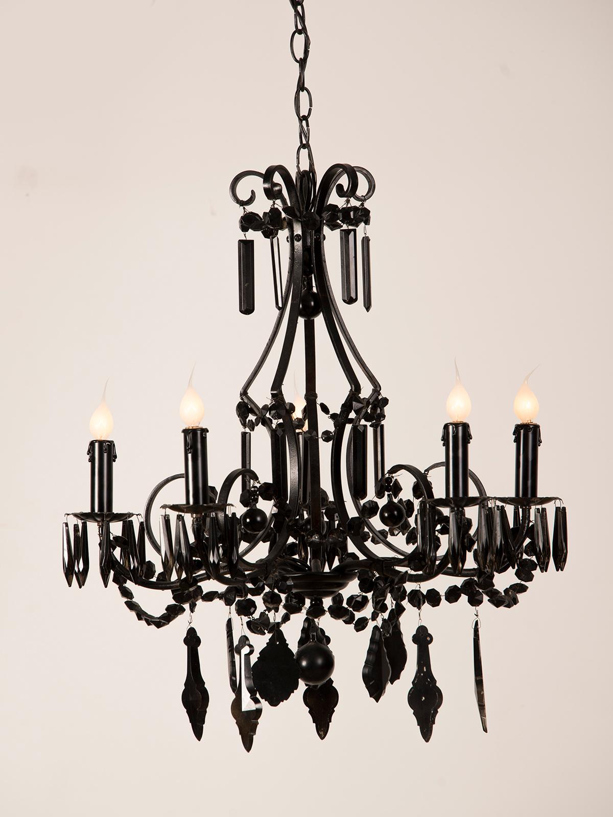 A stylish vintage French five-arm chandelier with the entire cage, crystal drops and beading painted black to resemble black crystal from France, circa 1940. The vintage crystal chandelier has timeless and Classic appeal but the conversion from