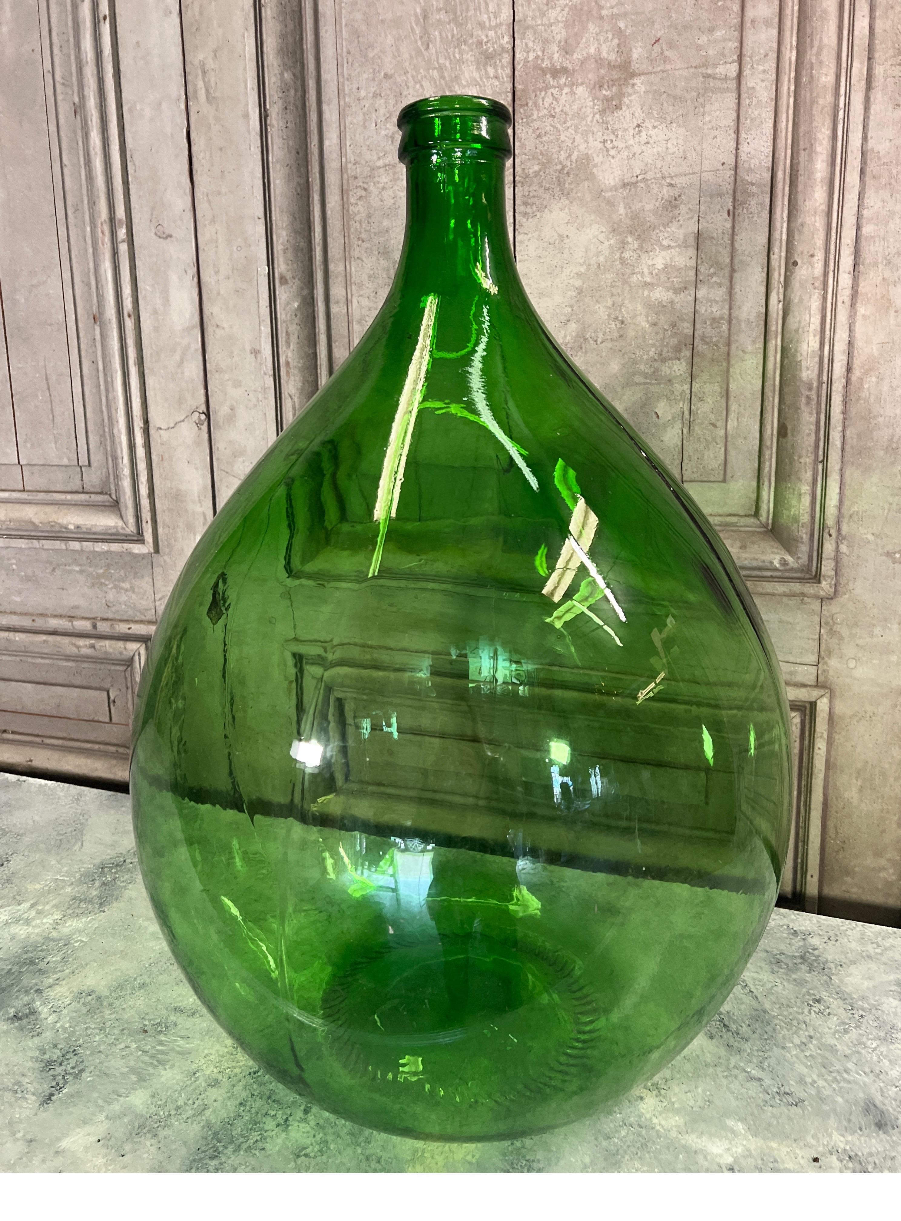 Our latest collection of large vintage French Dame Jeanne glass wine bottles have made their way from Provence and are now available! The oversized nature were once used for fermentation of wine and then covered in straw and wicker to protect the