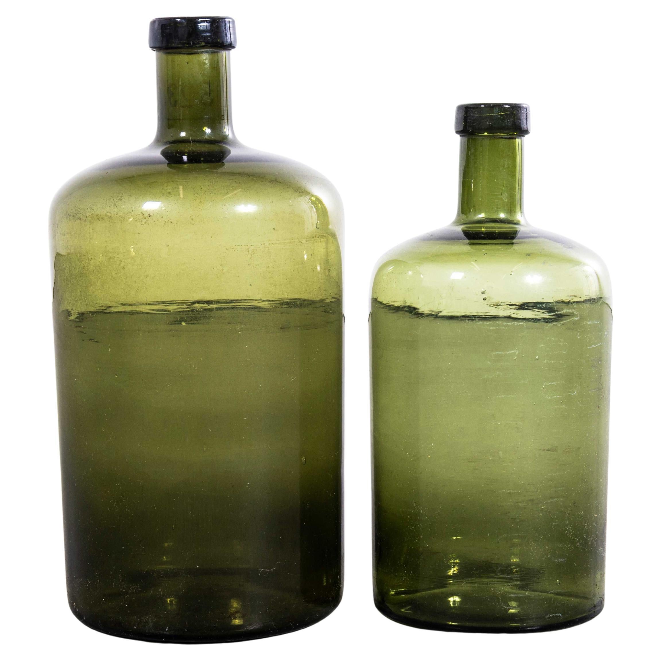 Damigiana francese vintage in vetro verde scuro - Coppia in vendita
