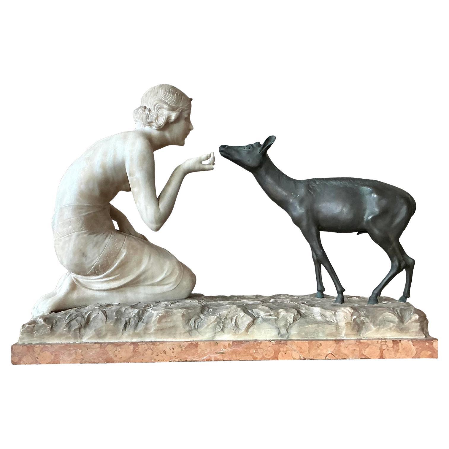 Scultura d
epoca in bronzo e pietra scolpita in stile Deco francese di R. Ponti "Femme a La Biche".