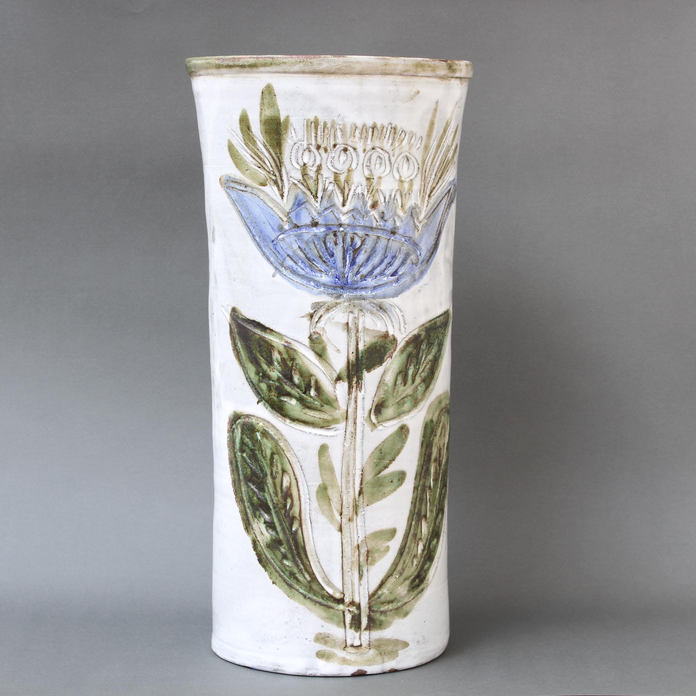 Mid-century decorative tall vase by Albert Thiry (circa 1960s). A gentle creamy-white glaze encompasses the exterior of the tall vase (it could also be used as an umbrella holder) topped at the lip by a soft grassy green. Covering the piece you will