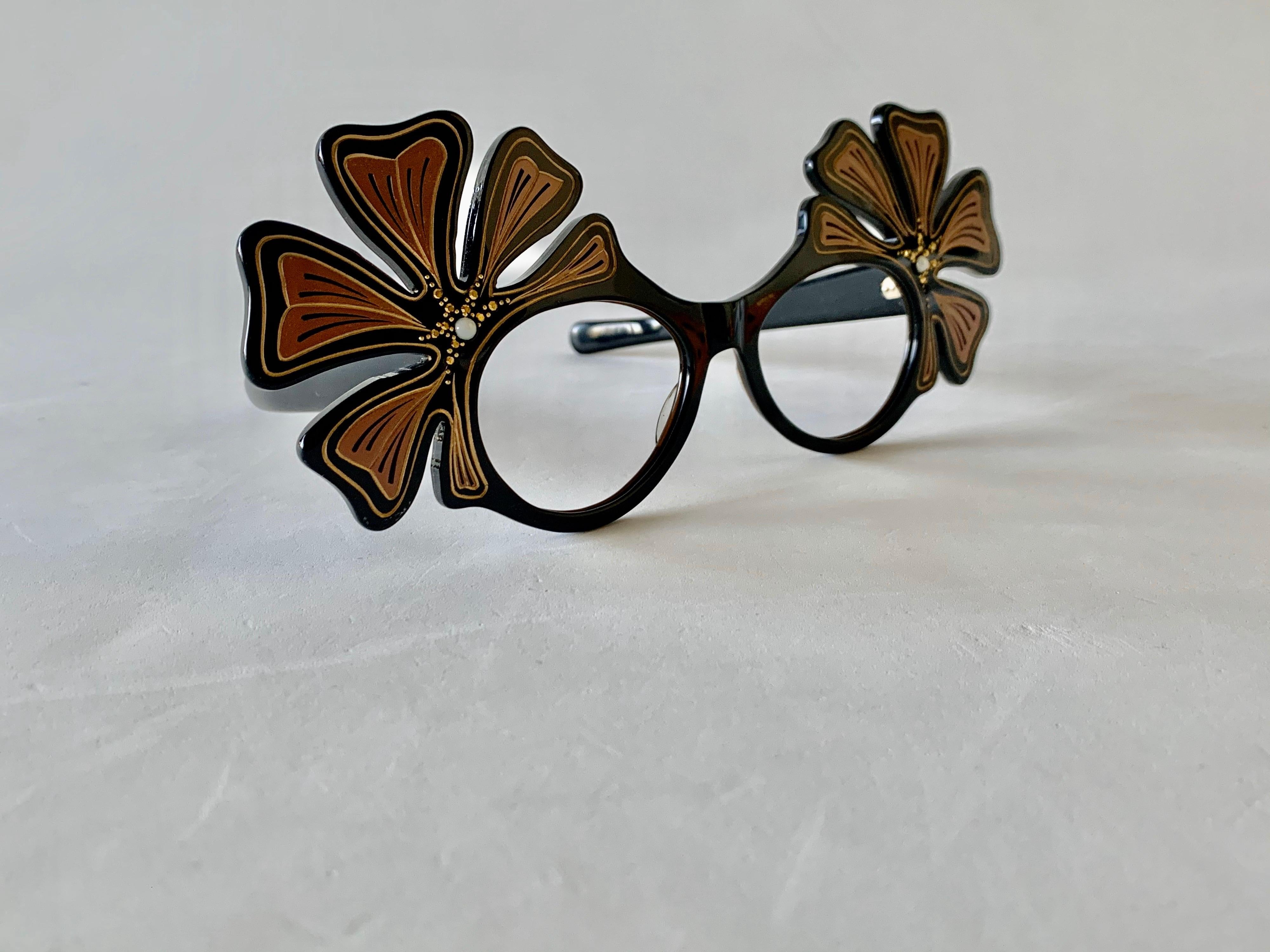 Unique one-of-a-kind deco wing Frames, hand painted and embellished with faux pearls and rhinestones for that WOW effect. Put in your own prescription in good company and turn your face into a work of art with this original pair of vintage
