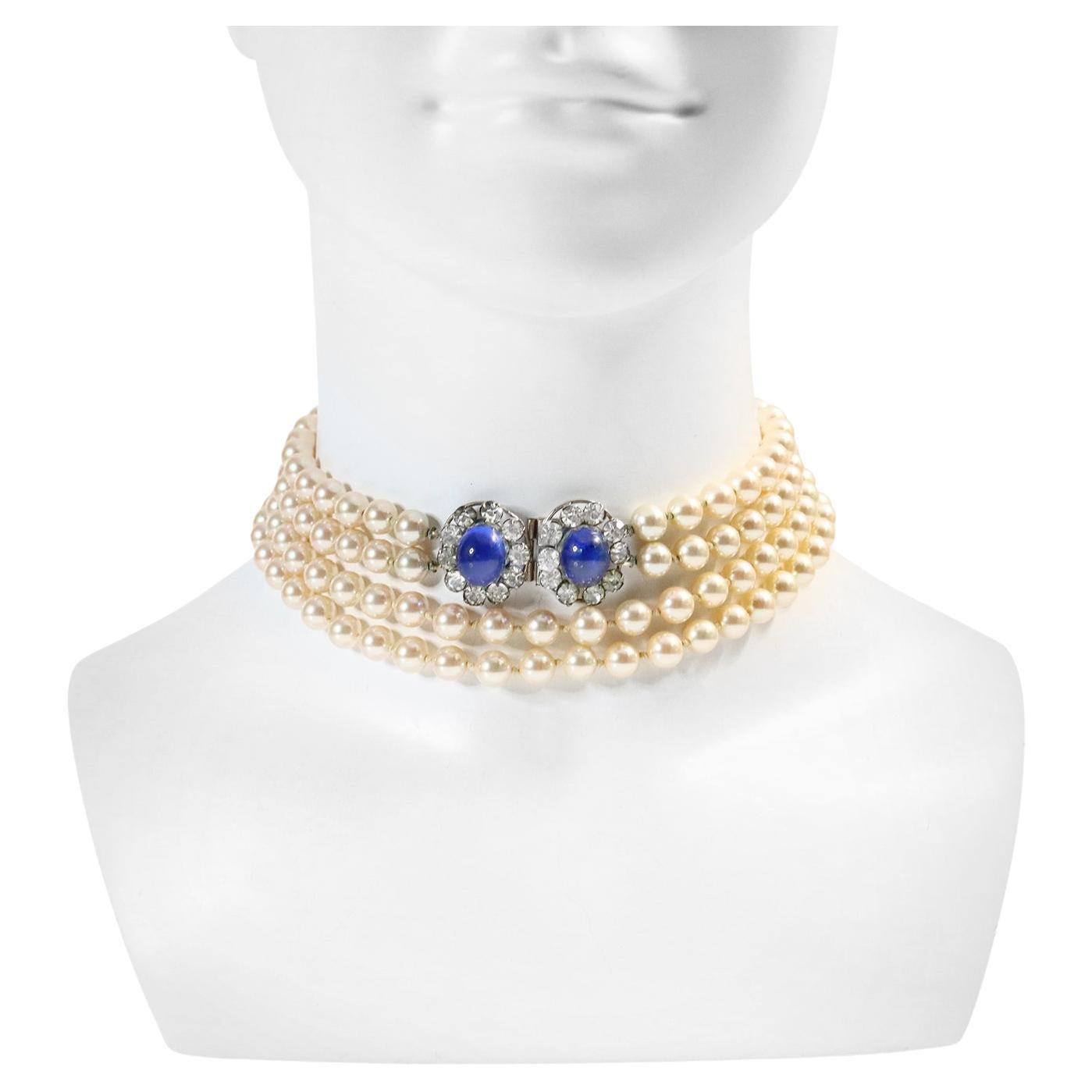 Vintage French Diamante Faux Double Pearl Long Necklace.  Blue cabochons surrounded by crystals make up the two clasps that are then joined by two long rows of faux double knotted heavy faux pearls.  They are 29