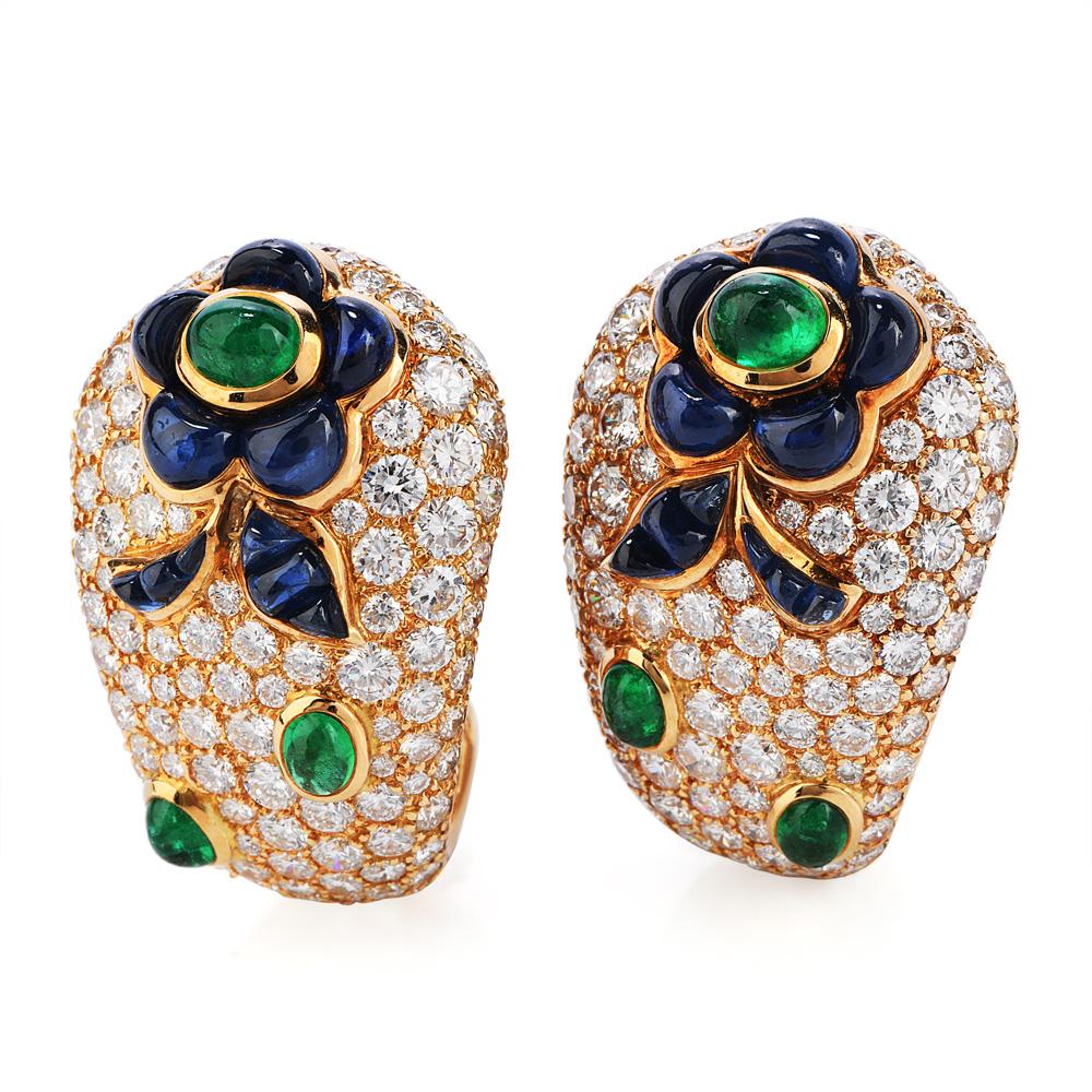 his French made Diamond, Emerald and Sapphire Clip gold earrings are sure to make a Statement in any room.

Wide throughout, covered with Pave' set diamonds and flower patterns of bezel-set Sapphire and emerald. 

Sapphire combined weight is approx.
