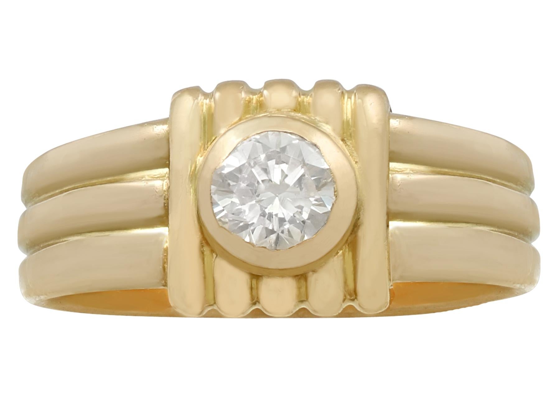 An impressive vintage 1950's French 0.32 carat diamond and 18k yellow gold dress ring; part of our diverse diamond jewelry and estate jewelry collections.

This fine and impressive vintage diamond ring has been crafted in 18k yellow gold.

The