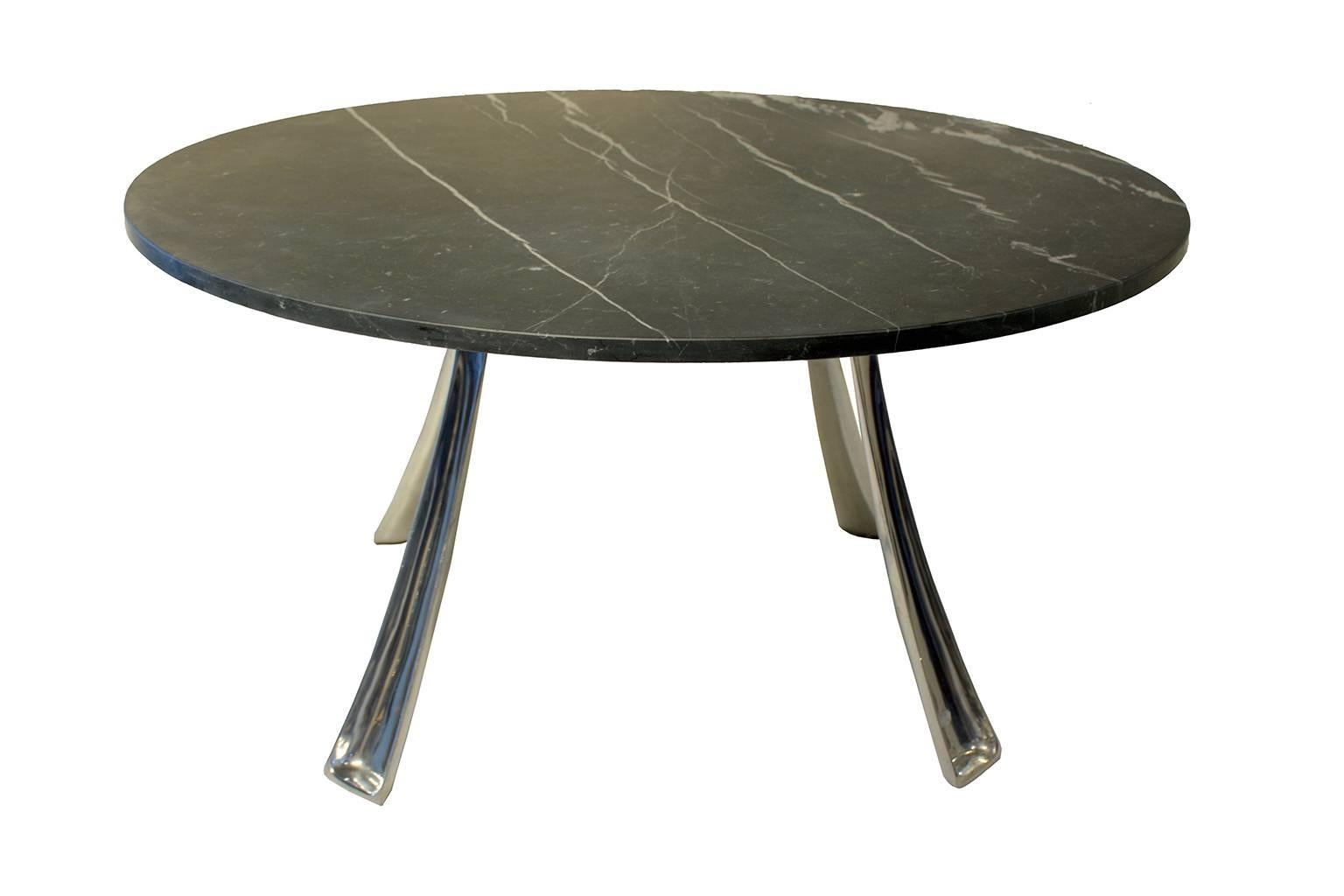 Aluminum base and marble top.