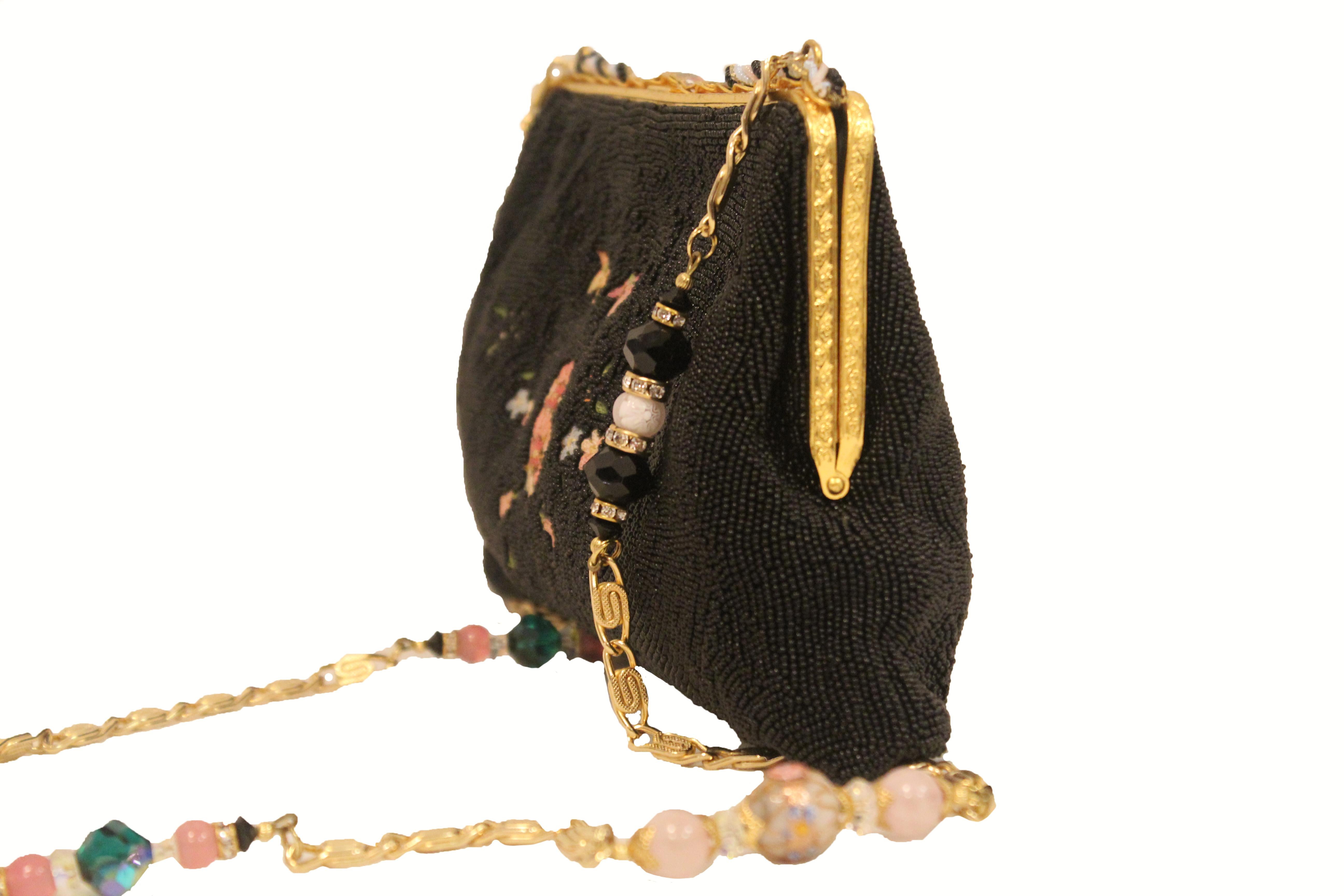 This is a quality made elegant beaded evening handbag with a keen visual appeal. The body of this purse appears to be all the same tone of black beads and it is in excellent condition.  The French led the way when it came to elegant beaded evening