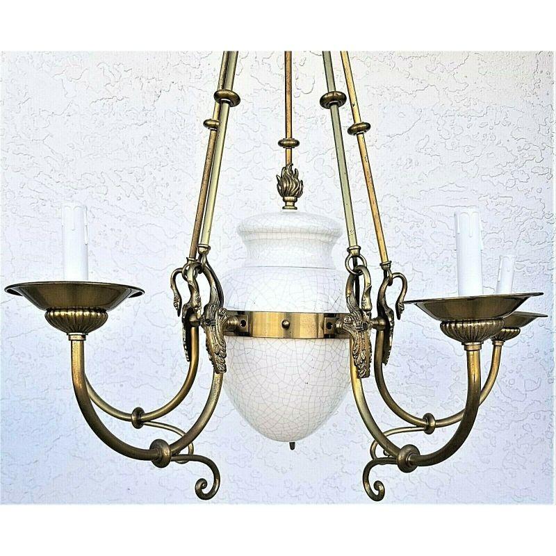 For FULL item description click on CONTINUE READING at the bottom of this page.

Offering one of our recent Palm beach estate fine lighting acquisitions of a
vintage French empire brass swans and porcelain 5 light chandelier

Featuring a