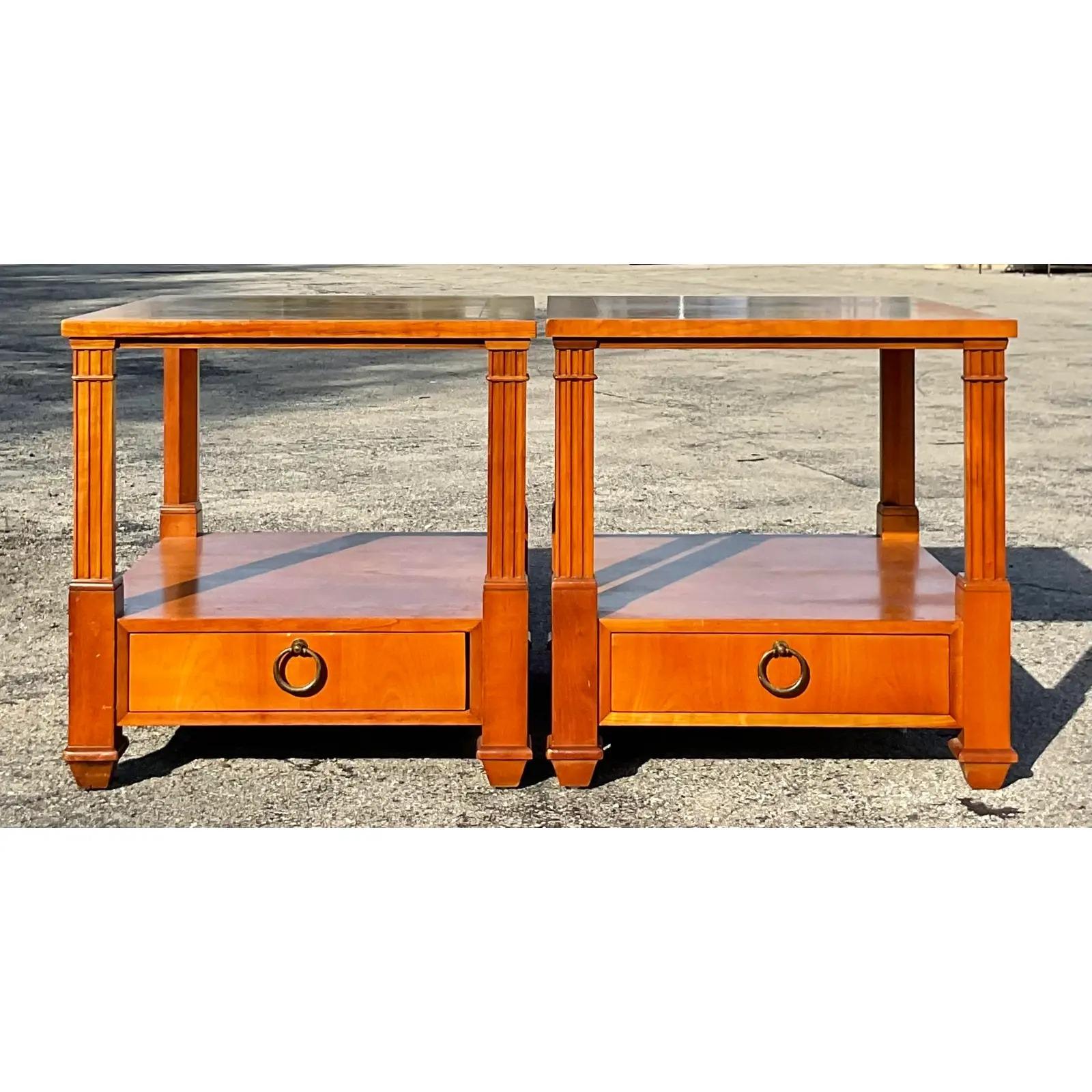 A fabulous pair of vintage Neoclassical nightstands. Made by the legendary Baker furniture group. Beautiful clean design with gorgeous wood grain detail.