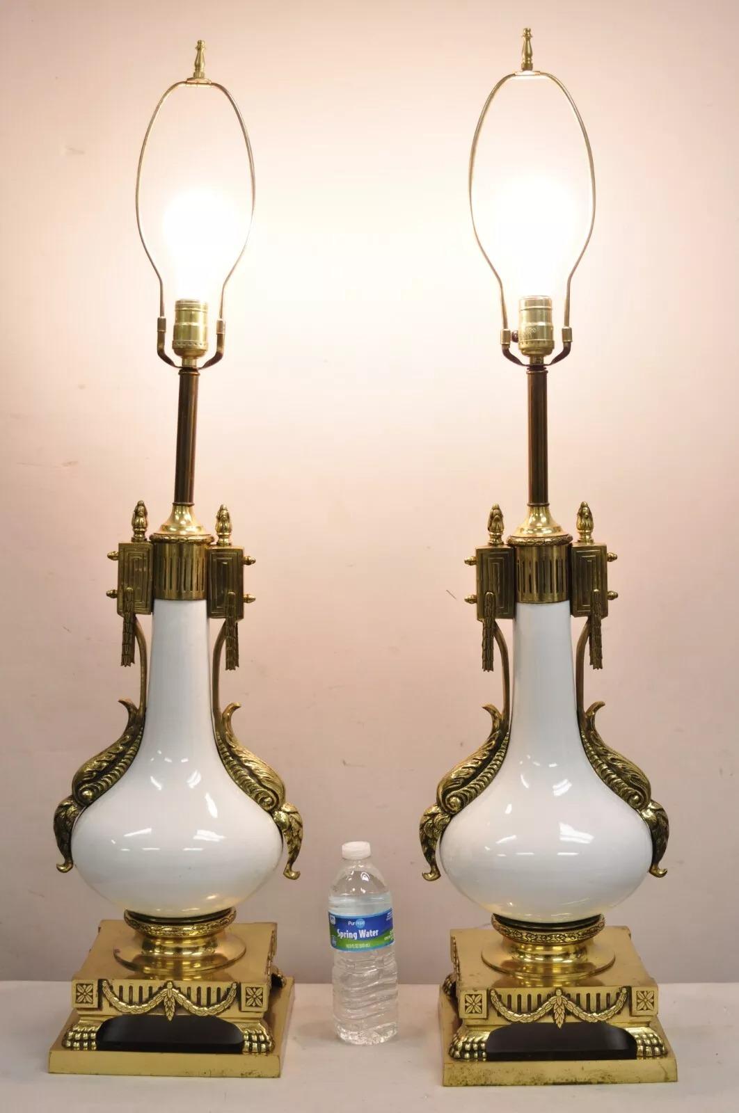 Vintage French Empire Neoclassical Style White Porcelain Bulbous Table Lamps with Ornate Polished Brass Ormolu - a Pair. Circa Mid 20th Century. Measurements: 39
