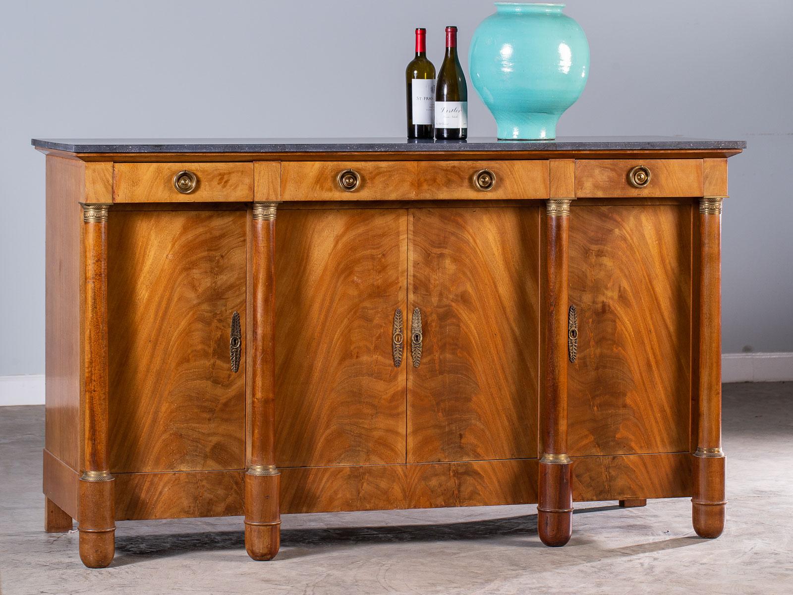 A chic vintage French Empire style mahogany buffet with a marble top circa 1920. The modern lines, elegant profile. superb material and excellent craftsmanship make this vintage buffet as desirable today as when it was first created. Empire style,
