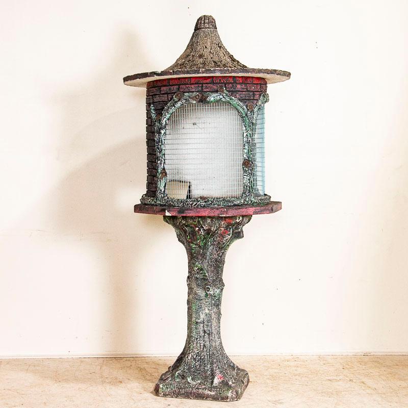 Wonderful example of French faux bois cement garden design, this large yet whimsical bird house will be a delightful addition to any garden, patio, or even used as a unique interior accent. Made of concrete in 3 sections: base, cage and roof.