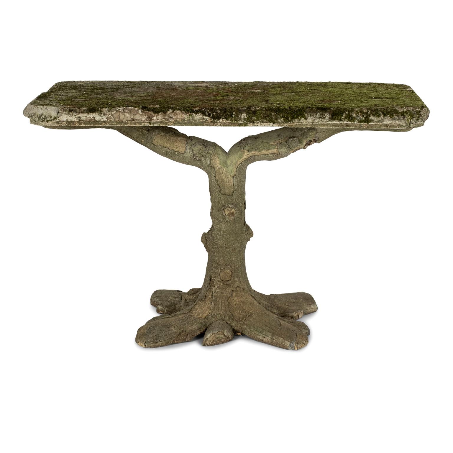 Vintage French faux bois garden console table covered in green lichen.