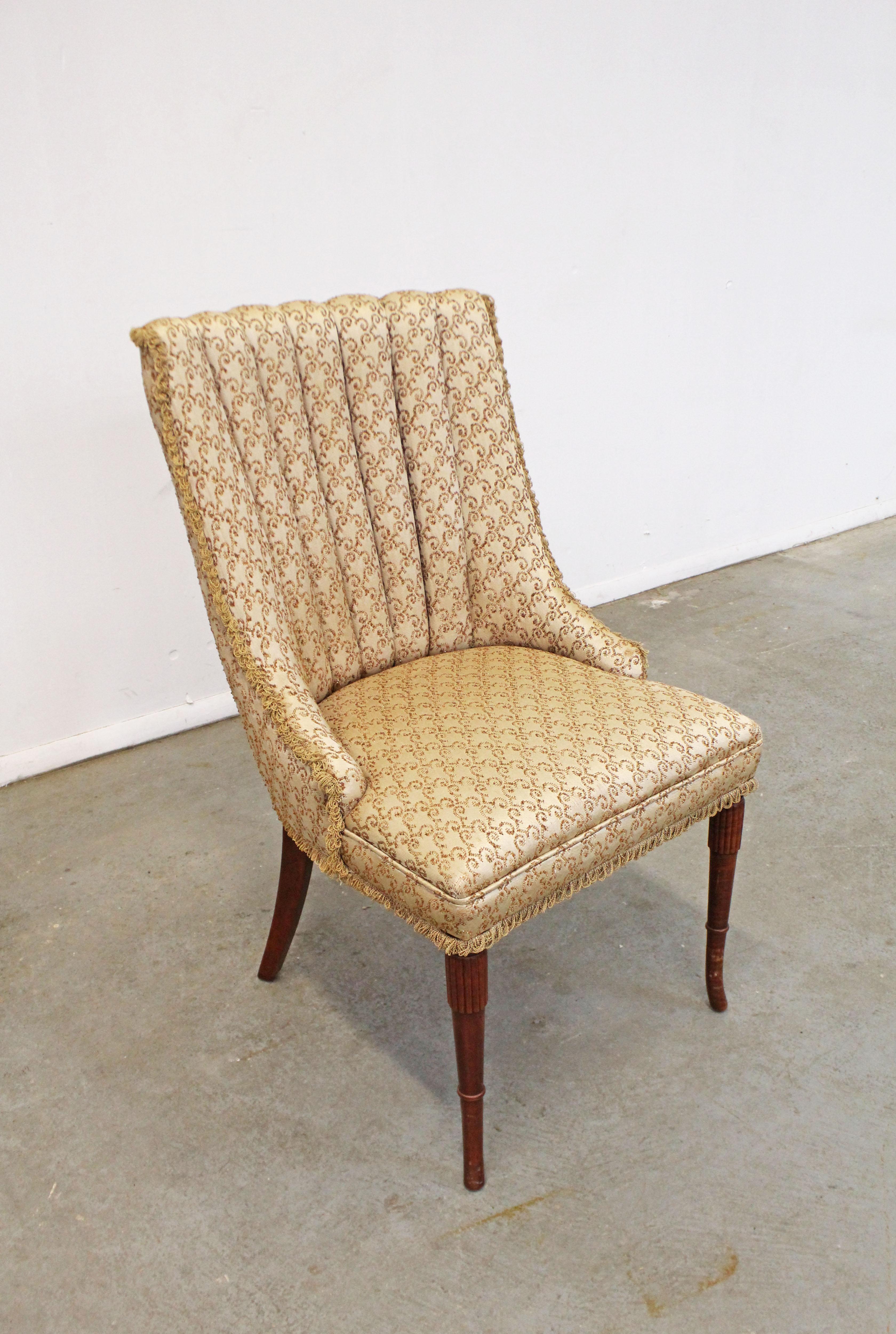 Offered is a vintage French style ladies parlor chair. Features fluted legs and gold upholstery. It is in good, structurally sound condition with minor age wear including small scuff/scratch marks on legs and slight tearing in fabric. Please review