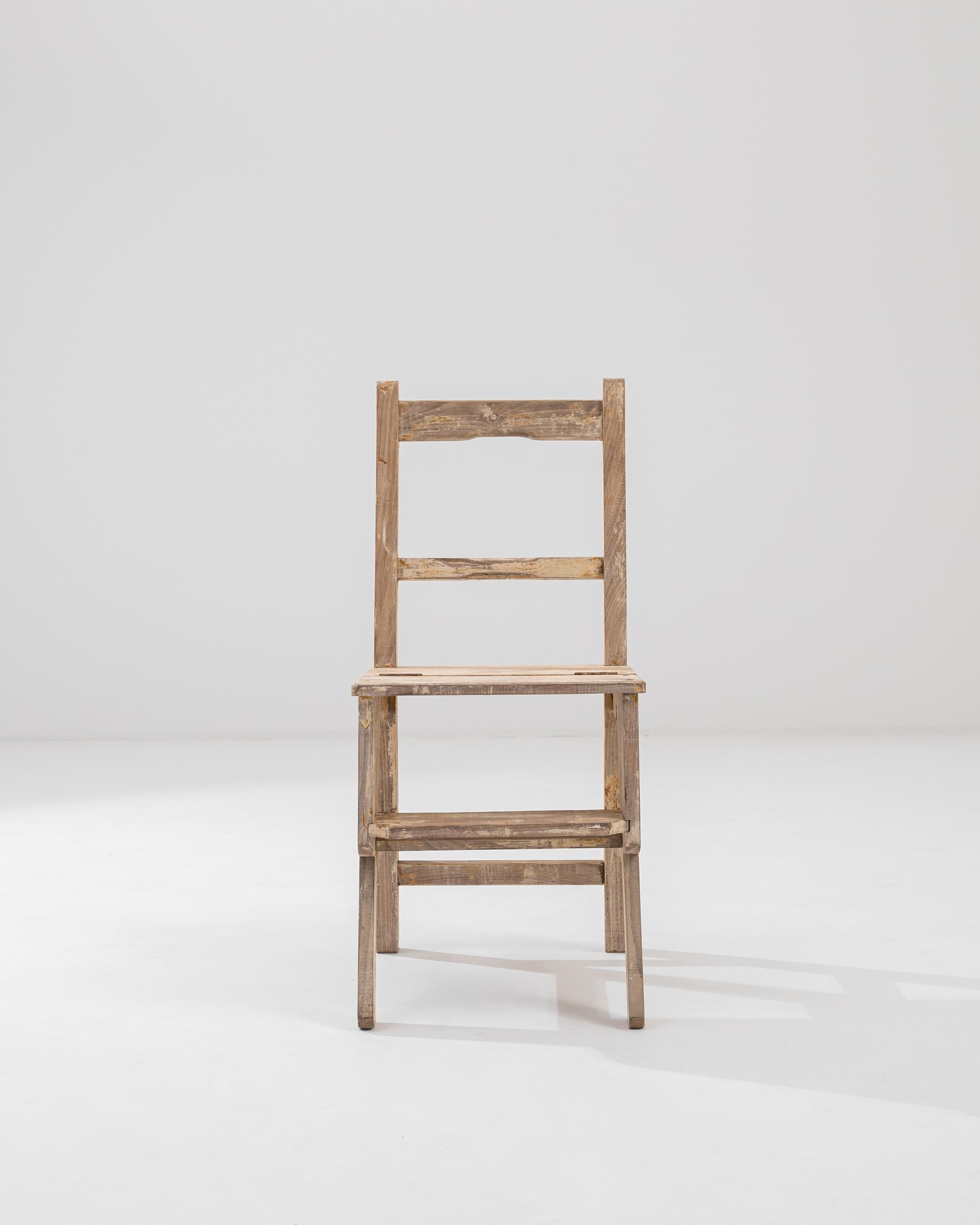 Pragmatic yet whimsical, this delightful set of chair steps is a unique piece of metamorphic furniture. Made in France at the turn of the century, the seemingly simple country chair doubles as a ladder, which unfolds when the seat is rotated on its