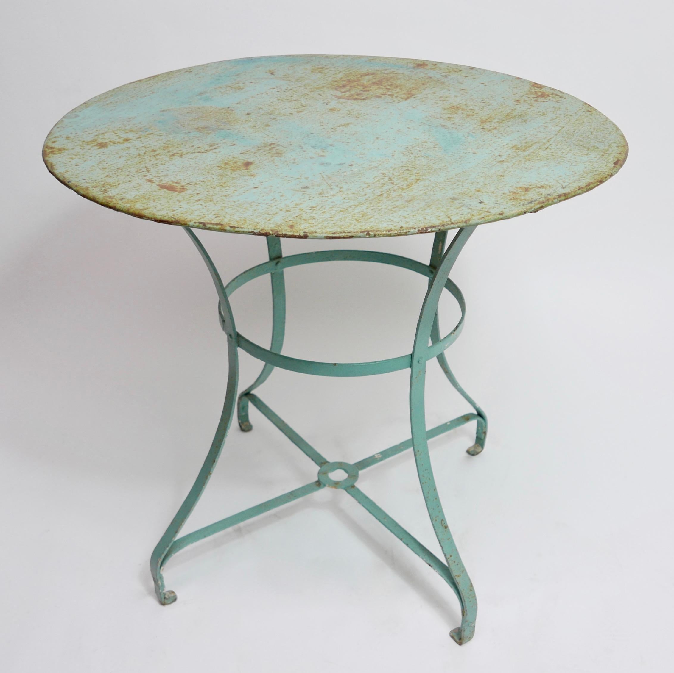 Metal garden or bistro table with beautifully aged and weathered turquoise paint, France. Early to mid-20th century.