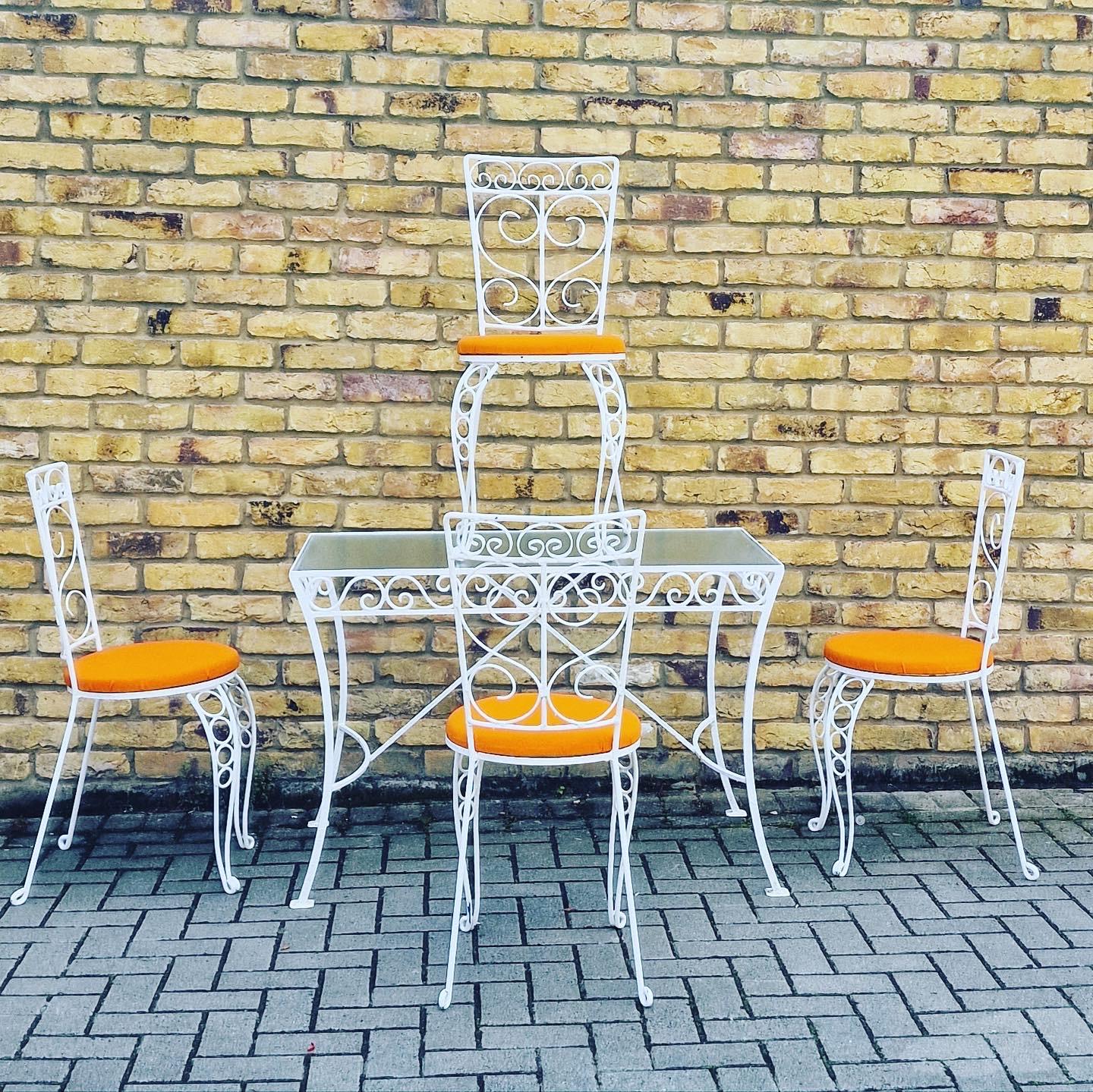 Compact Garden set with table and 4 chairs excellent reupholstered orange cushions 

Cc 1960’s French.
