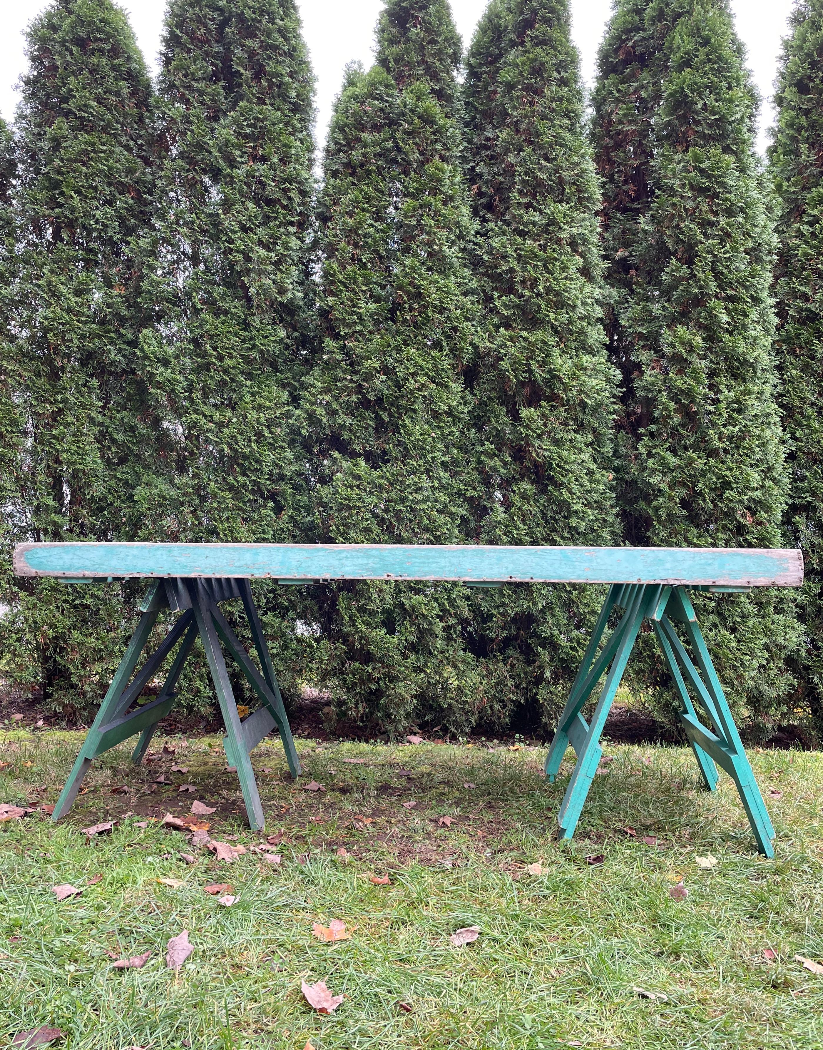 We found this wonderful garden work/potting table near LeMans and it’s a cracker. Made of what appears to be laminated oak with screw construction, it is in three parts: the slatted top and two height-adjustable trestle bases. And we love that you