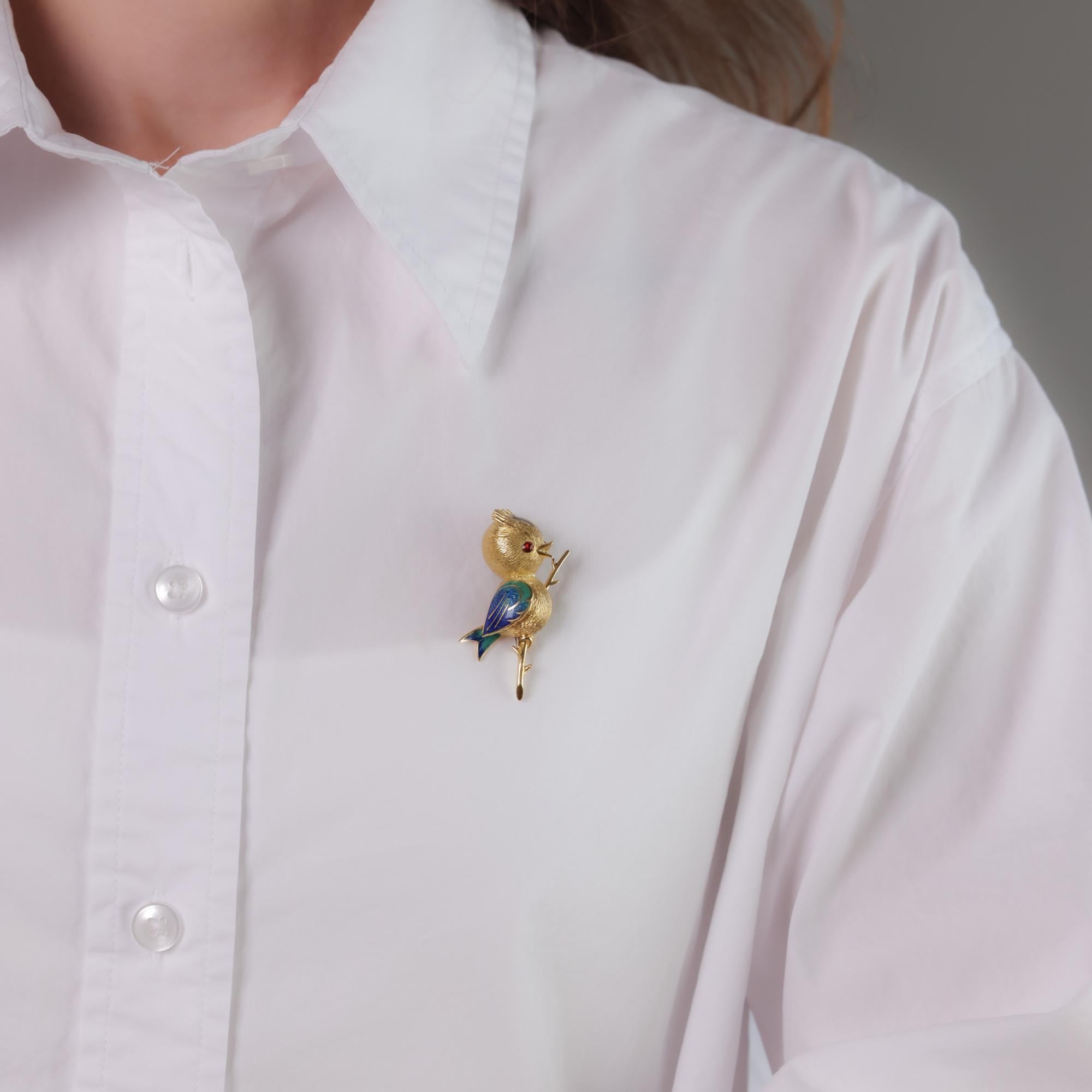 This vintage 18k yellow gold and enamel brooch features two cabochon-cut garnets. Hallmarked with the French eagle head and maker’s marks. Circa 1980s.

Center stone: 2 cabochon cut garnets 
Metal: 18k yellow gold and enamel 
Era: Vintage 
Circa: