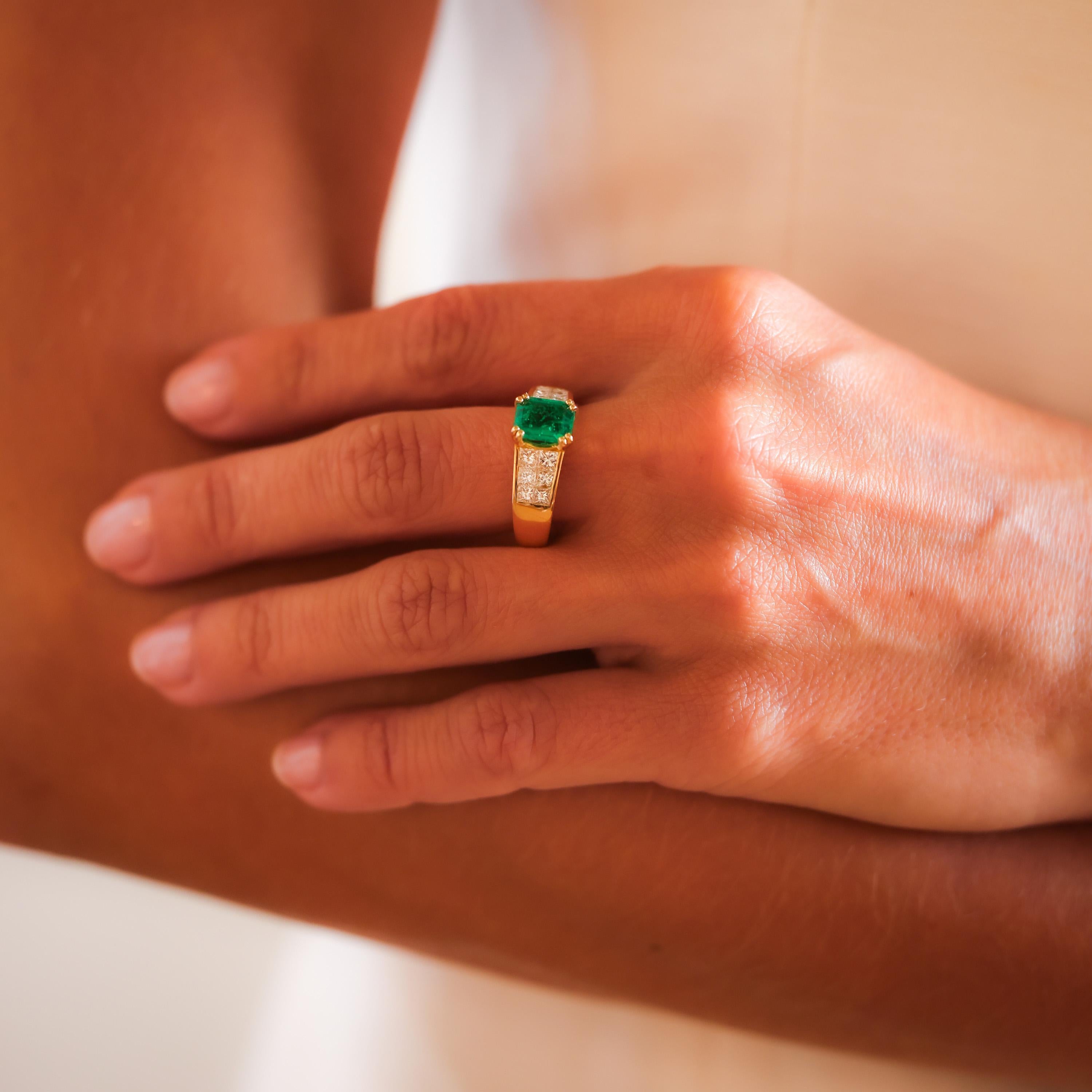Center Stone: Octagonal Cut Emerald
Certificate: GIA #5221947032
Weight:  1.25 Carat
Origin: Colombia
Treatment(s): F2
Accent Stone: 12 Princess Cut Diamonds
Weight: Approximately 1.2 Carats
Color: F
Clarity: VS
Metal: 18K Yellow Gold
Era: