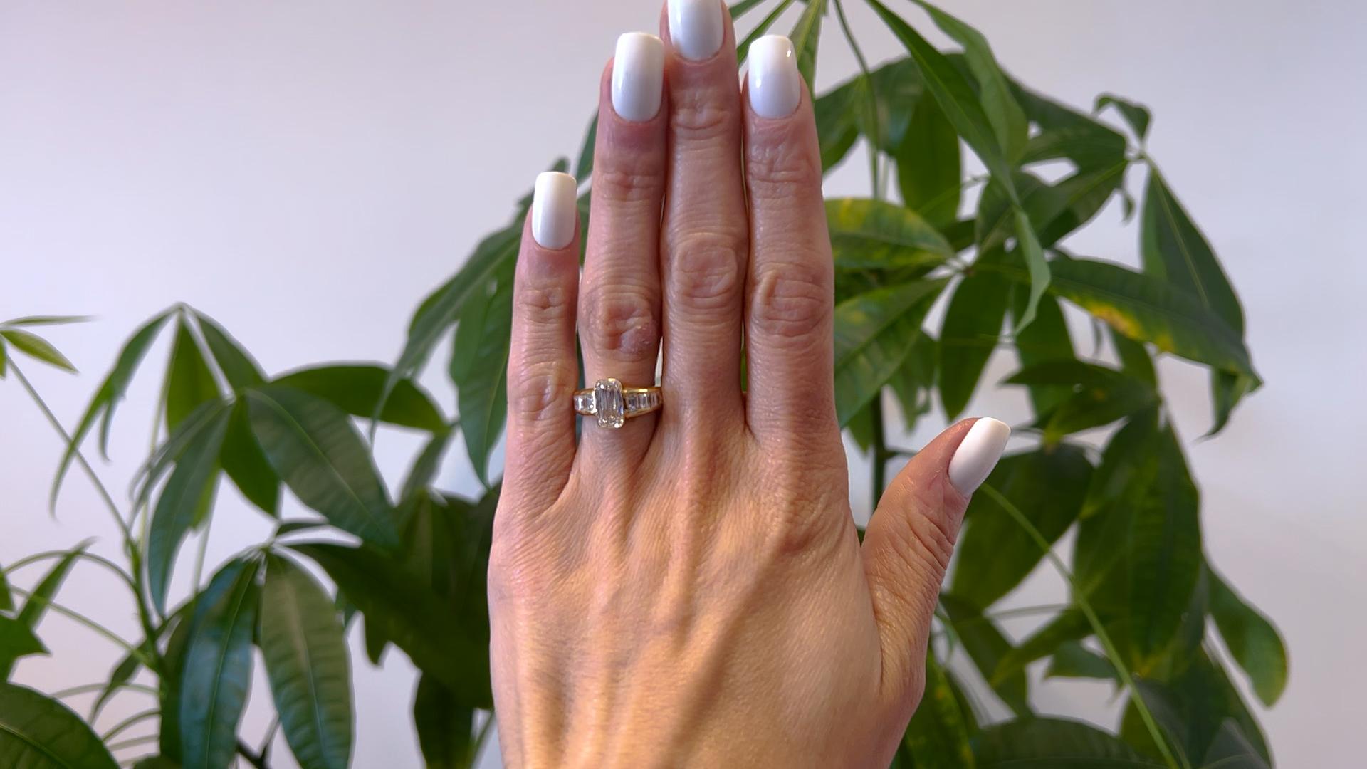 One Vintage French GIA 2.02 Carat Rectangular Modified Brilliant Cut Diamond 18k Yellow Gold Ring. Featuring one GIA round-cornered rectangular modified brilliant cut diamond of 2.02 carats, accompanied with GIA #6224808580 stating the diamond is I