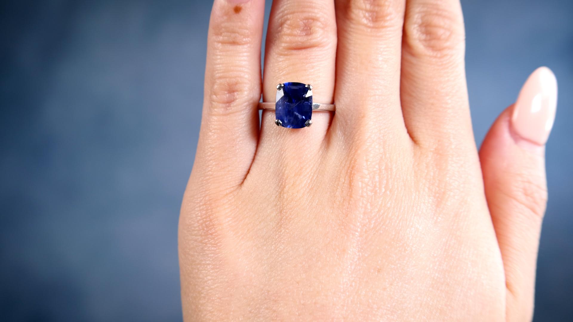 One Vintage French GIA 4.24 Carat Ceylon Sapphire 18k White Gold Solitaire Ring. Featuring one GIA cushion mixed cut sapphire of 4.24 carats, accompanied by GIA #2239197750 stating the sapphire is of Ceylon (Sri Lanka) origin. Crafted in 18 karat